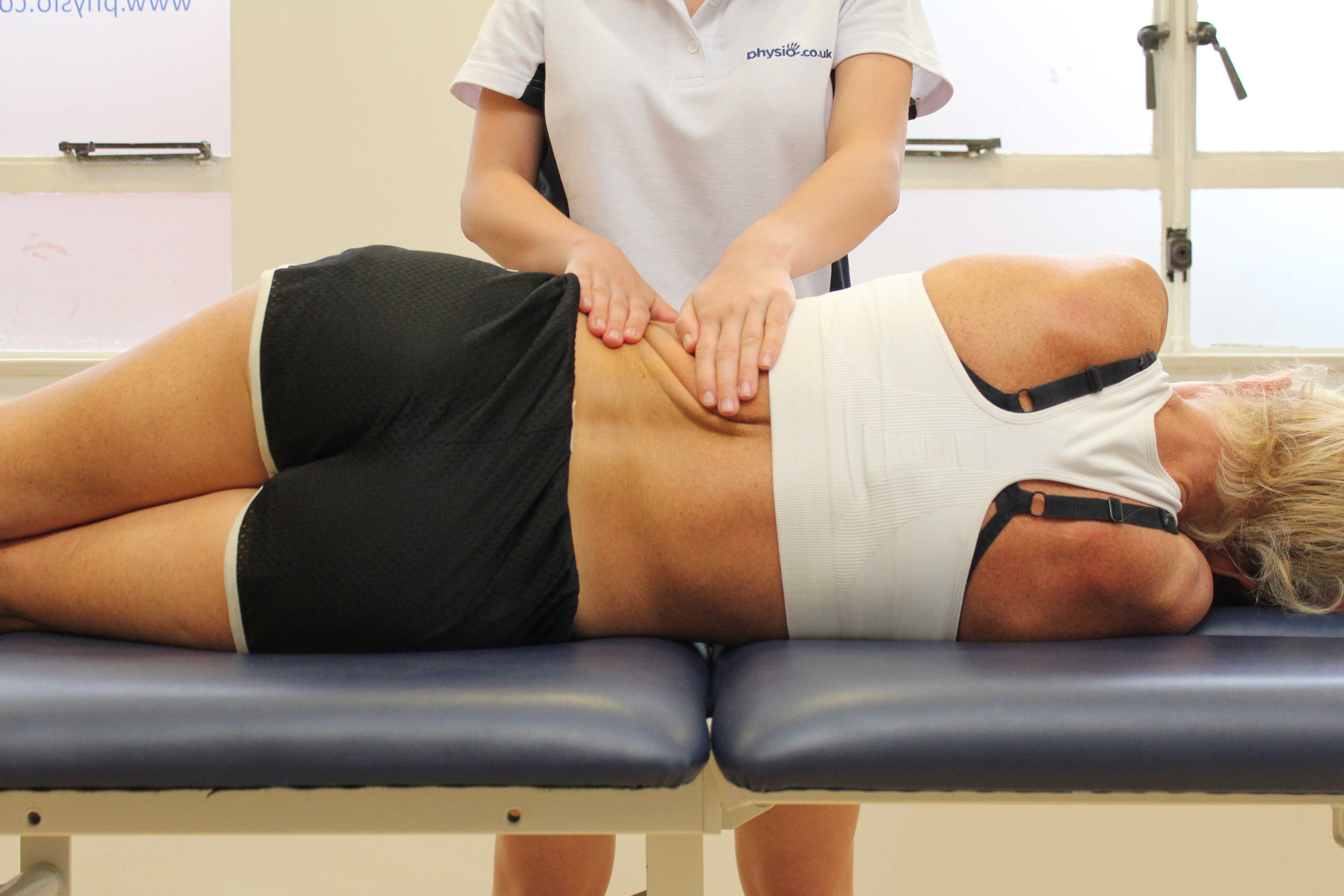 Soft tissue massage of oblique abdominal muscles