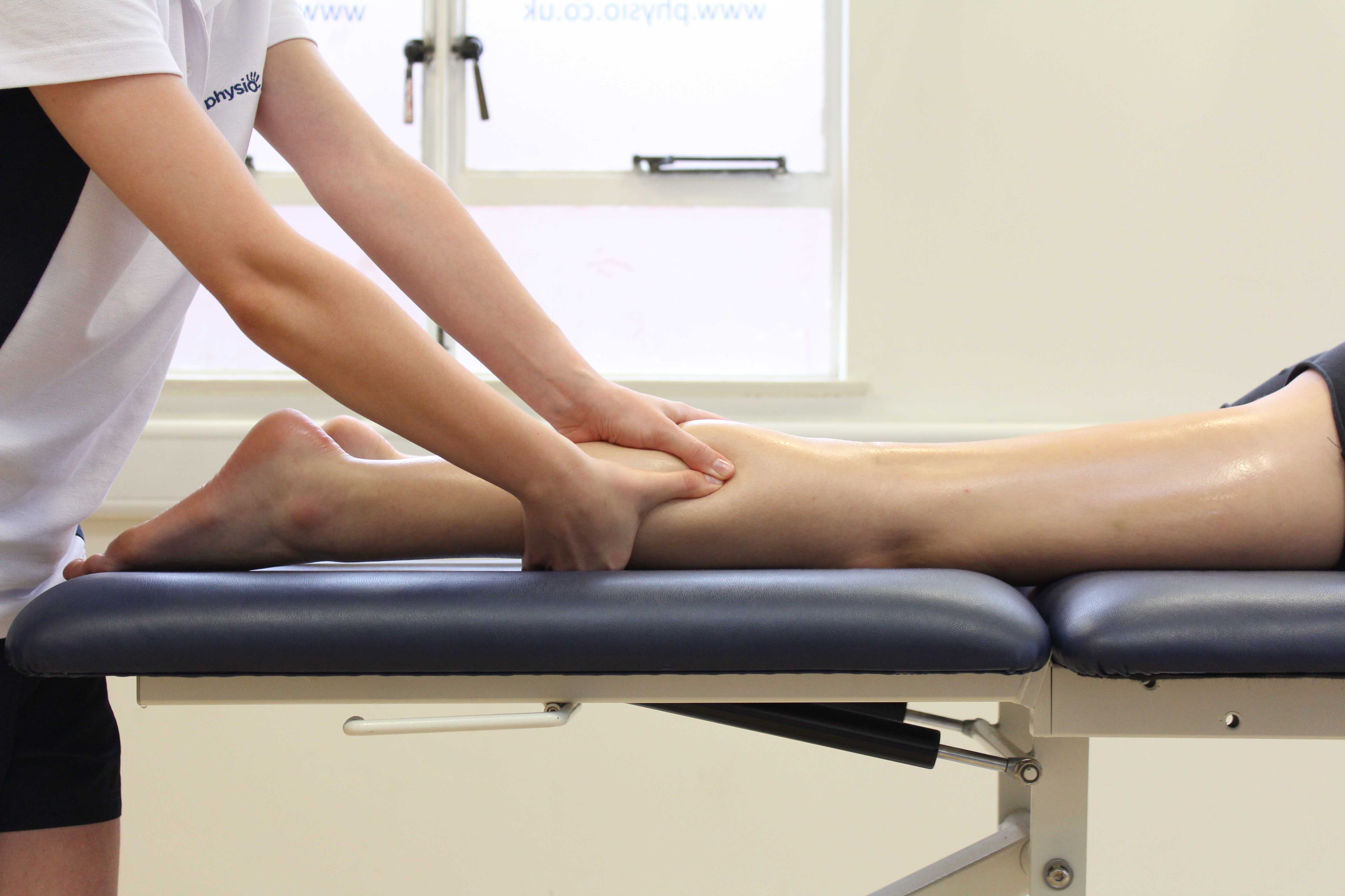 Accupressure massage of the gastroc nemius muscle by physiotherapist