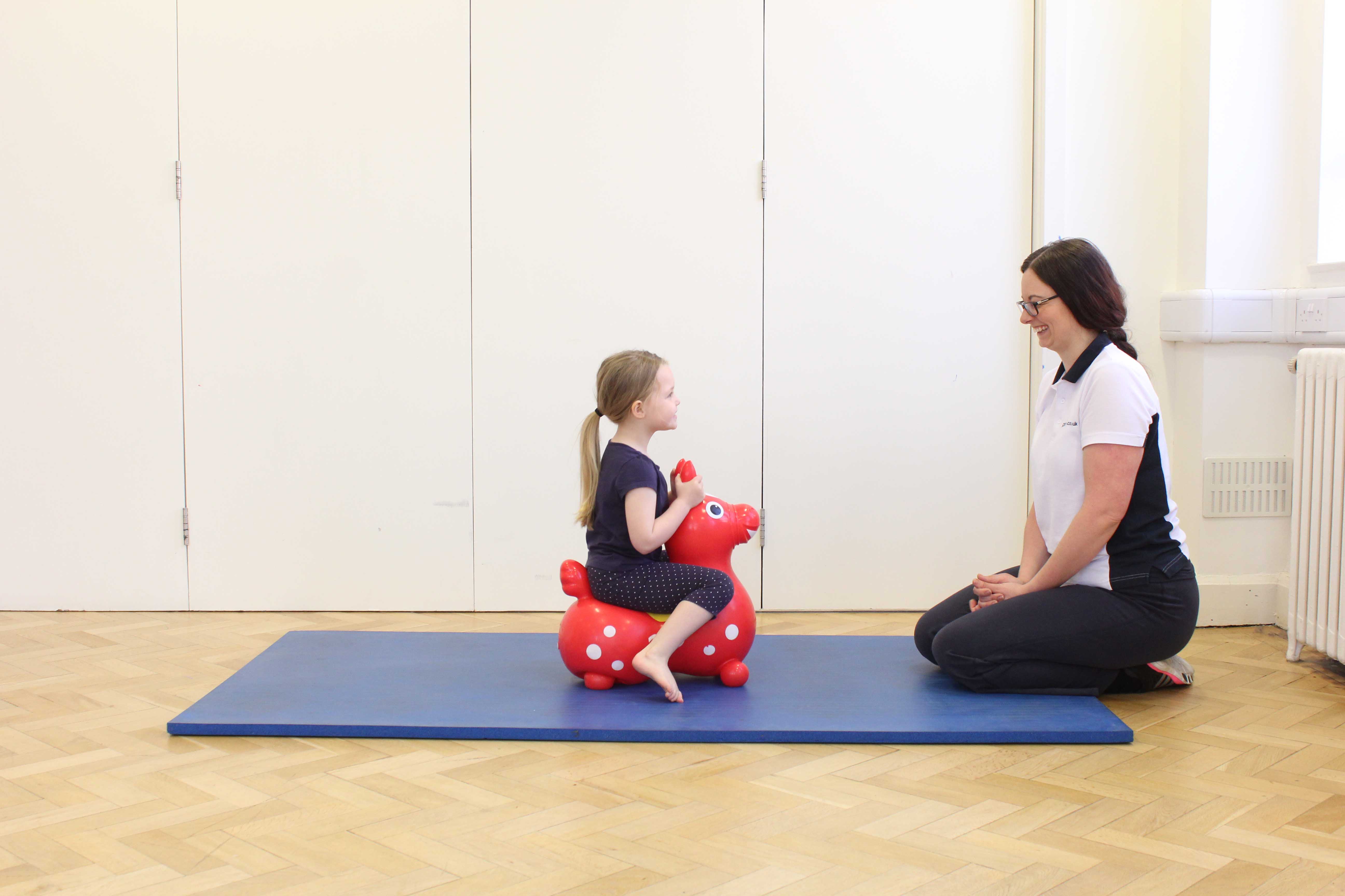 Paediatric physiotherapist promoting functional ability through play activities