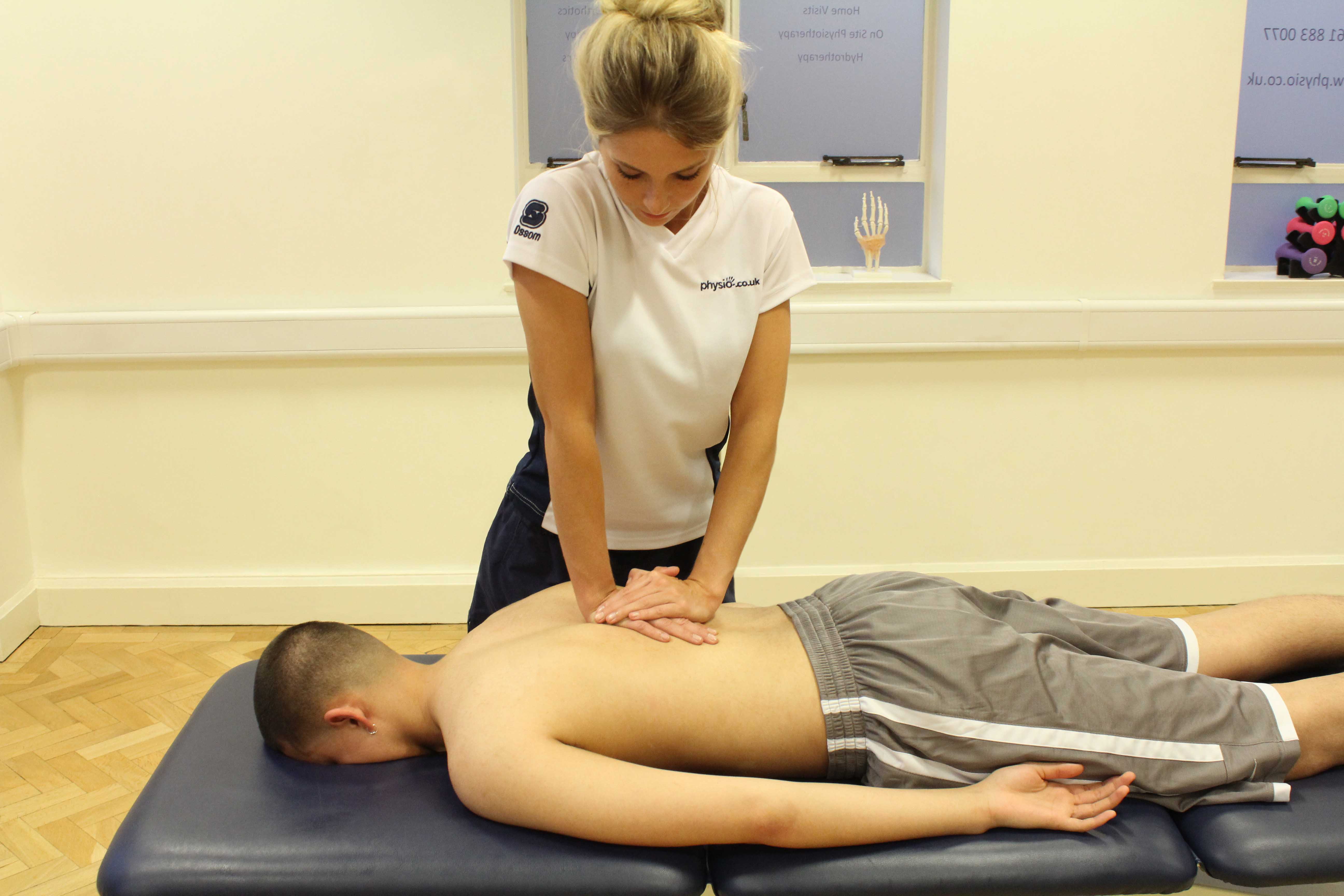 compression massage technique applied to thoracic spine