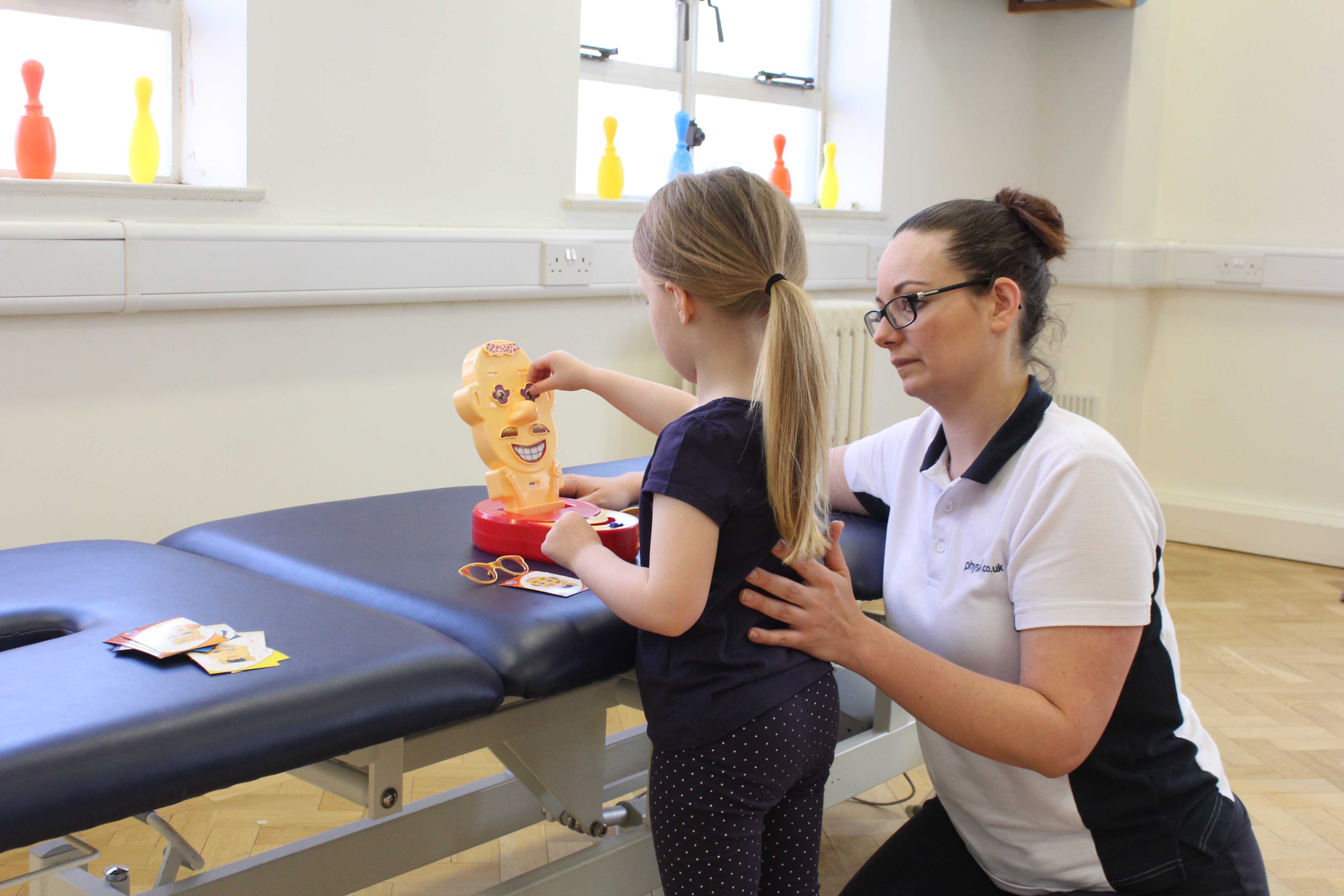 Functional fine motor skill exercises supervised by a neurological physiotherapist