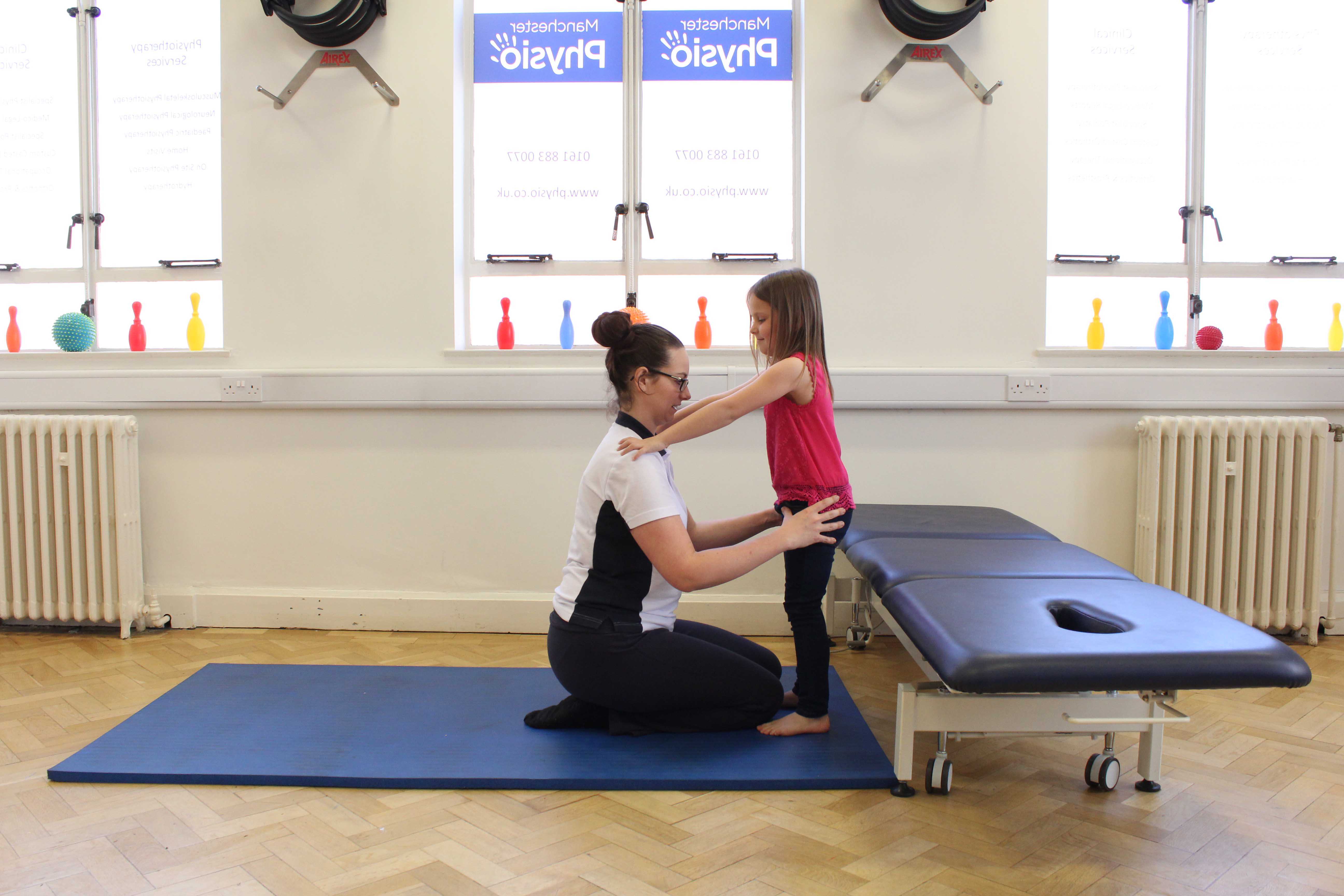 Mobility exercises encouraging development of functional abilities overseen by paediatric physiotherapist