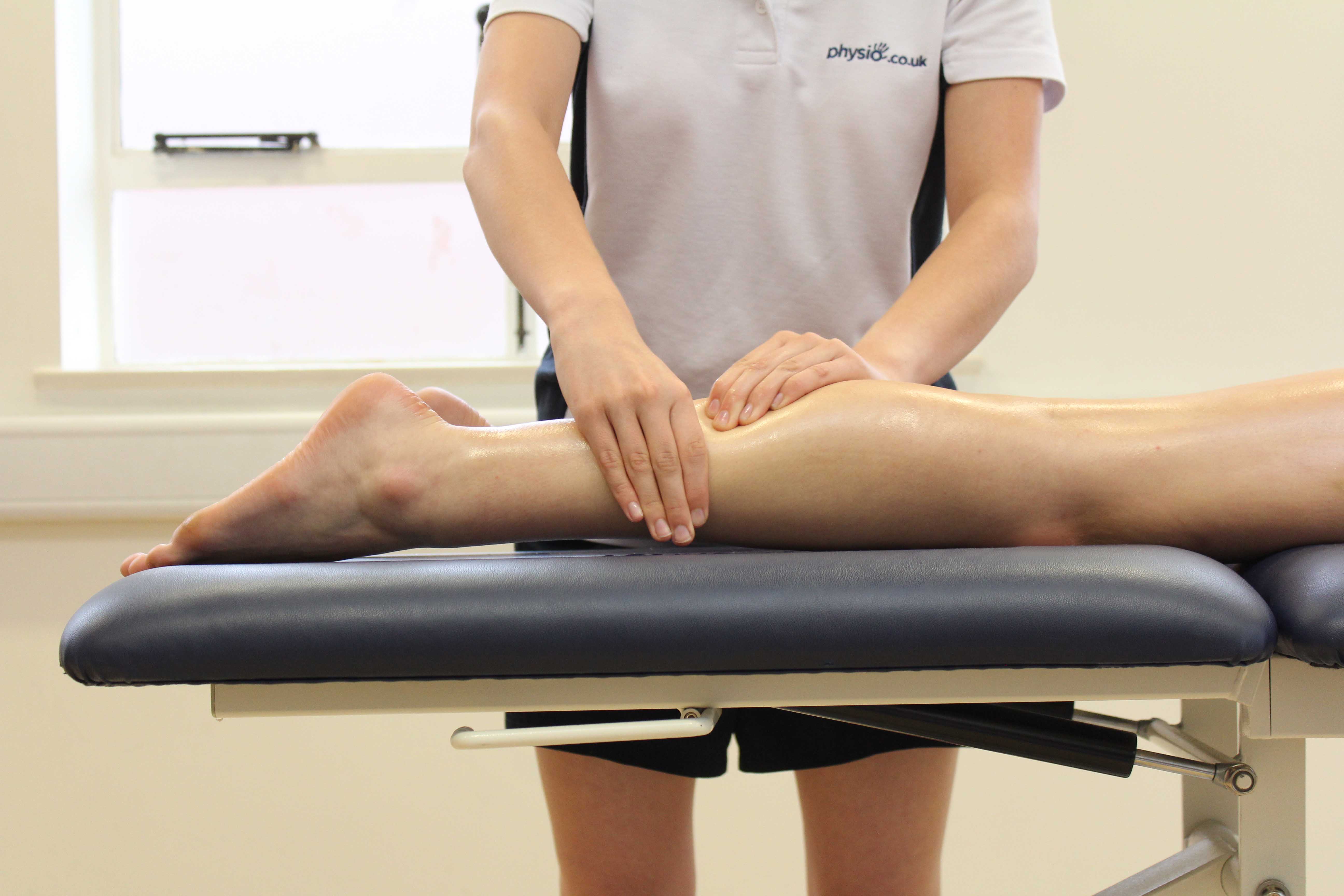 Rolling soft tissue massage applied to the gastrocnemius muscle by experienced therapist
