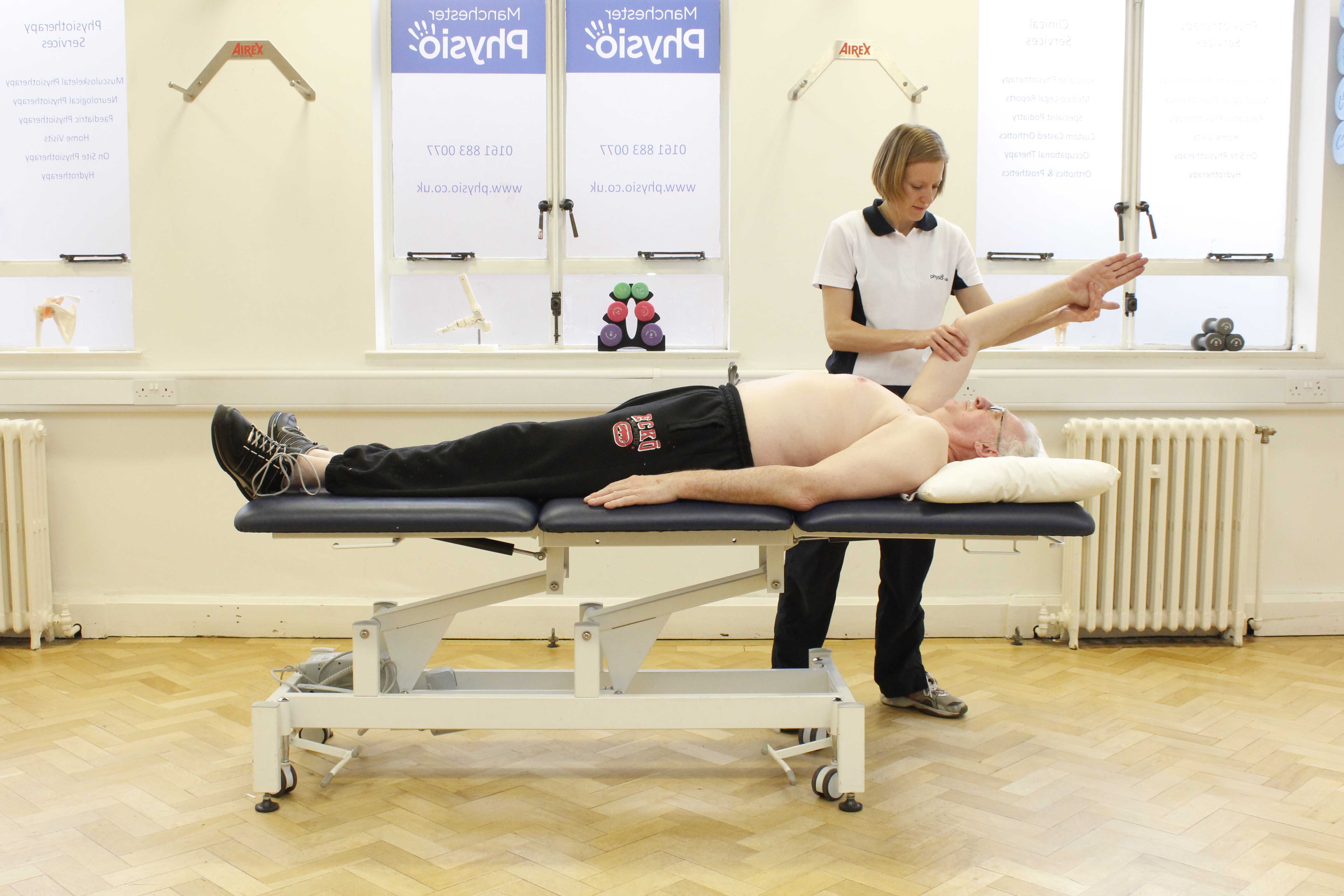 Passive mobilisations and stretches of the shoulder and elbow by a specilaist physiotherapist