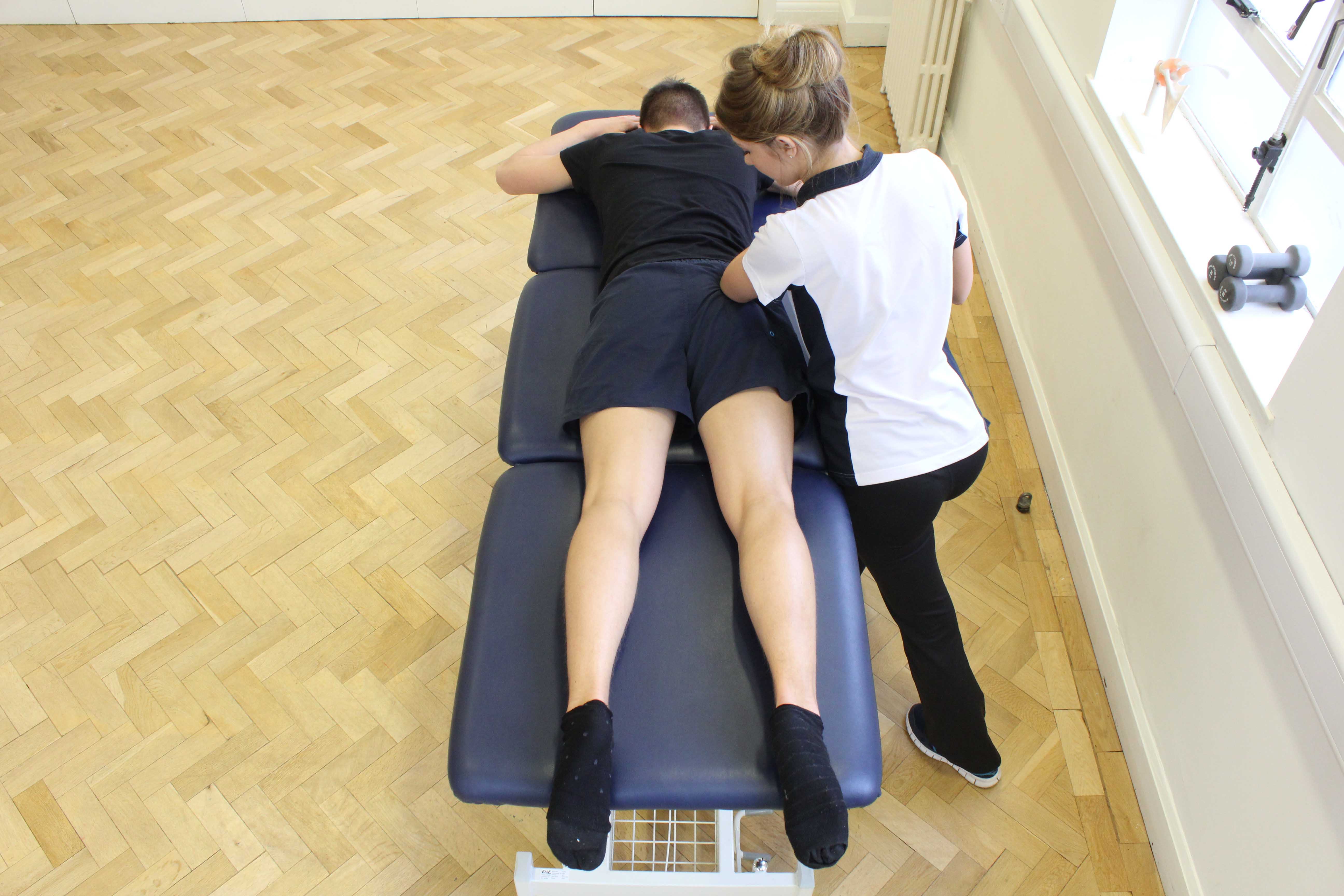 Deep tissue massage of the gluteus muscle by specialist MSK therapist