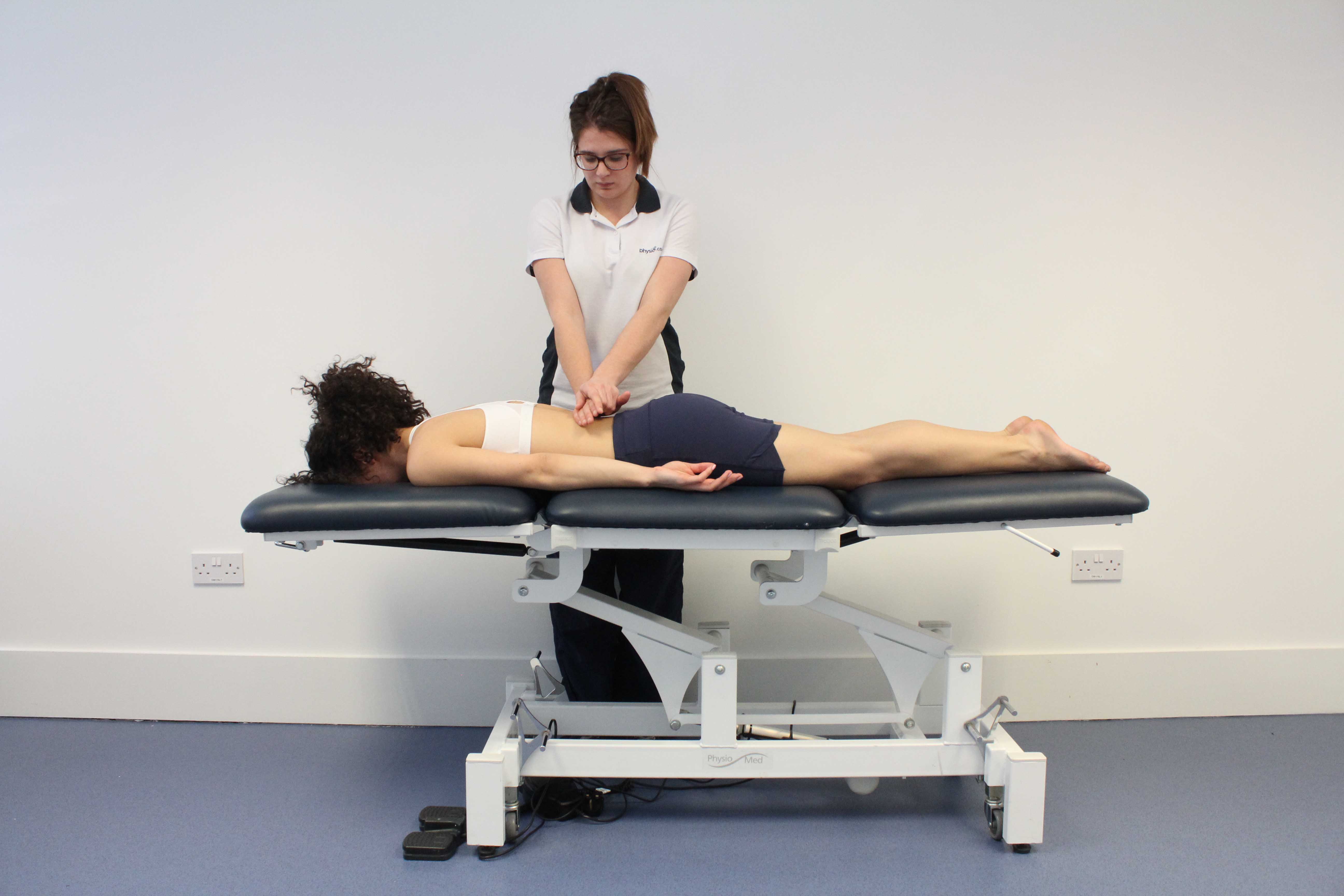 Mobilisations of the vertebrea in the lower back by a physiotherapist