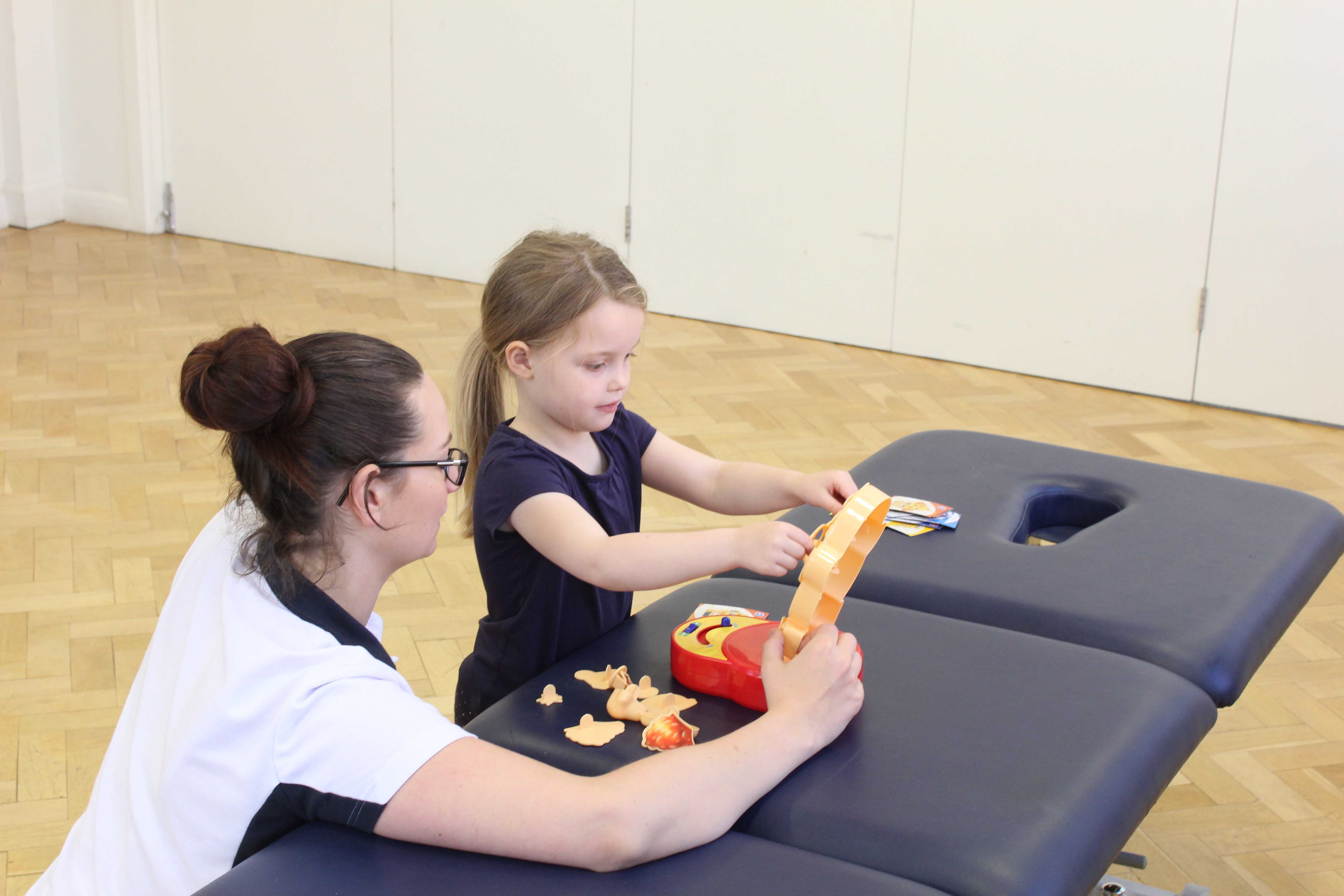Fine motor skills and co-ordination exercises supervised by a paediatric physiotherapist