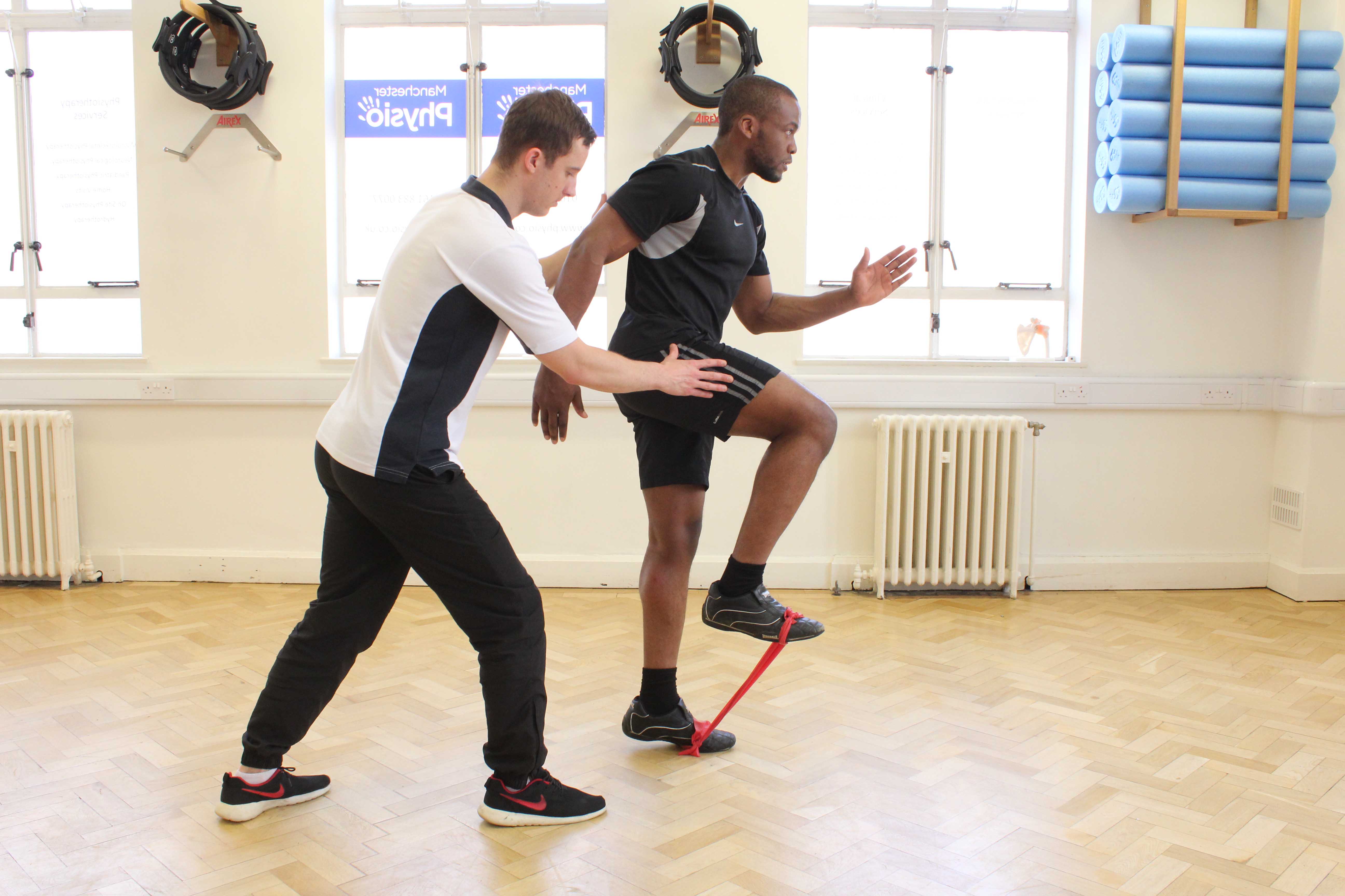 Sport rehabilitation mobility exercises using a resistance band under physiotherapy supervision