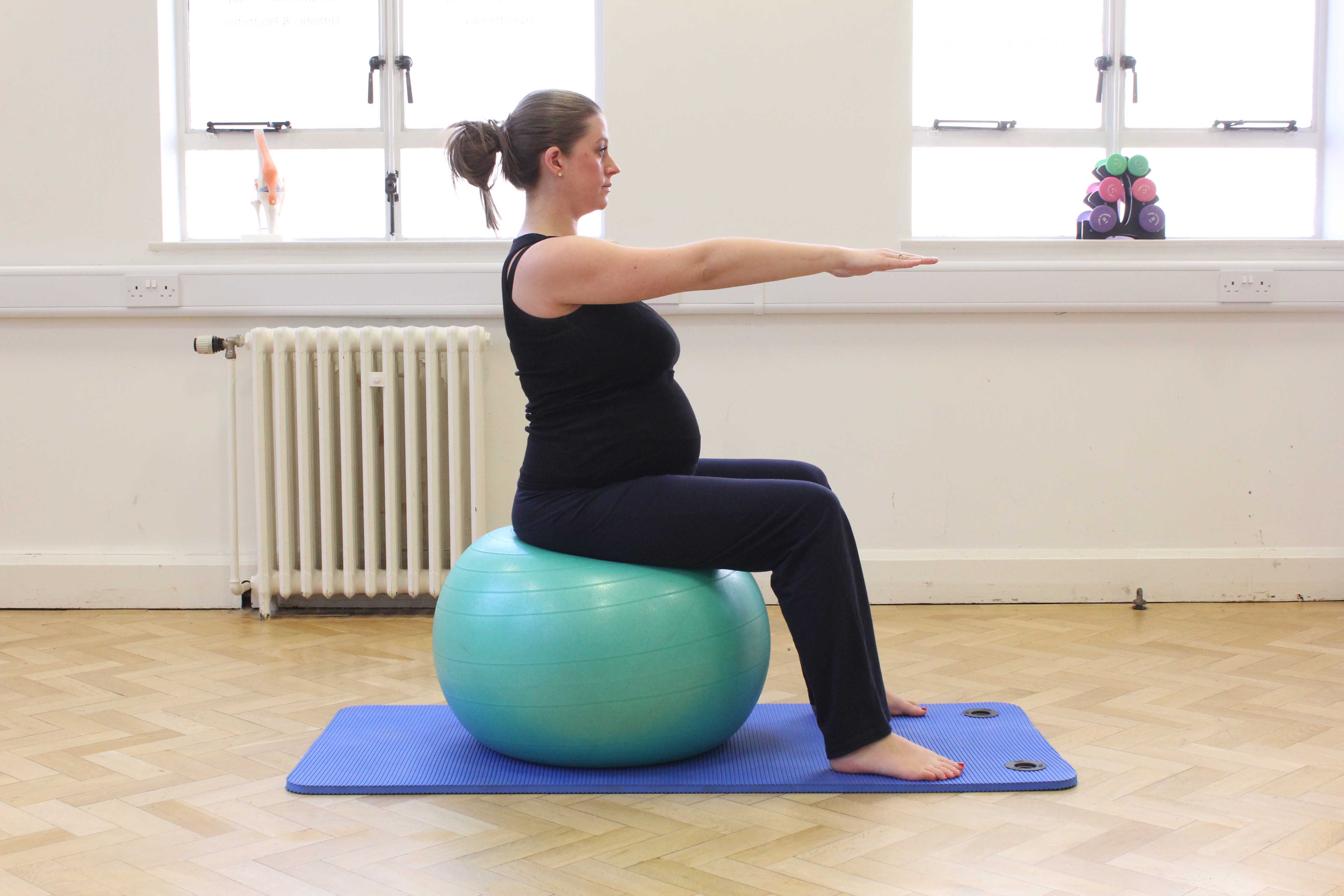 Addressing lower back pain by improving posture a muscle tone using a gym ball