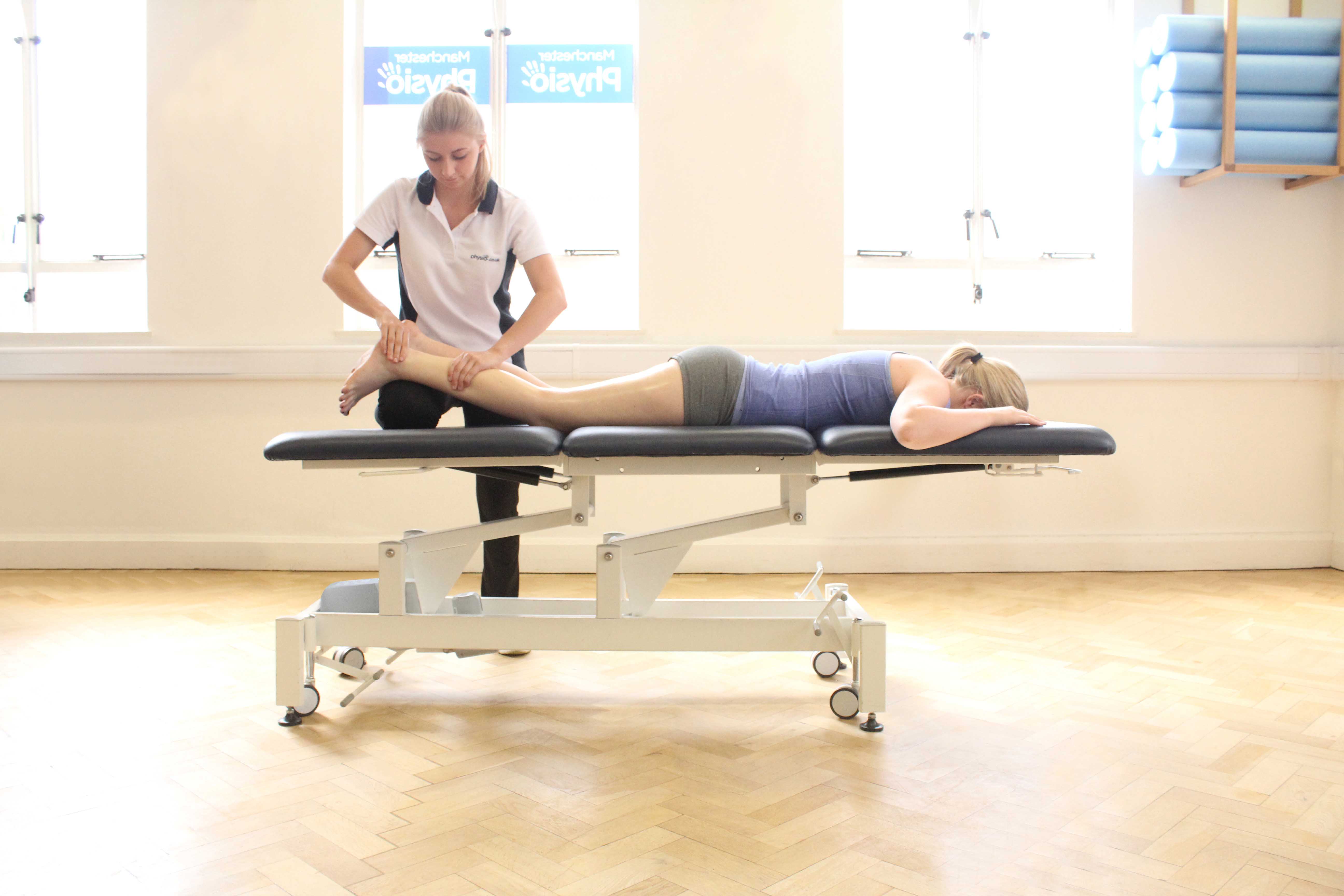 Soft tissue massage of the gastrocnemius muscle by MSK therapist