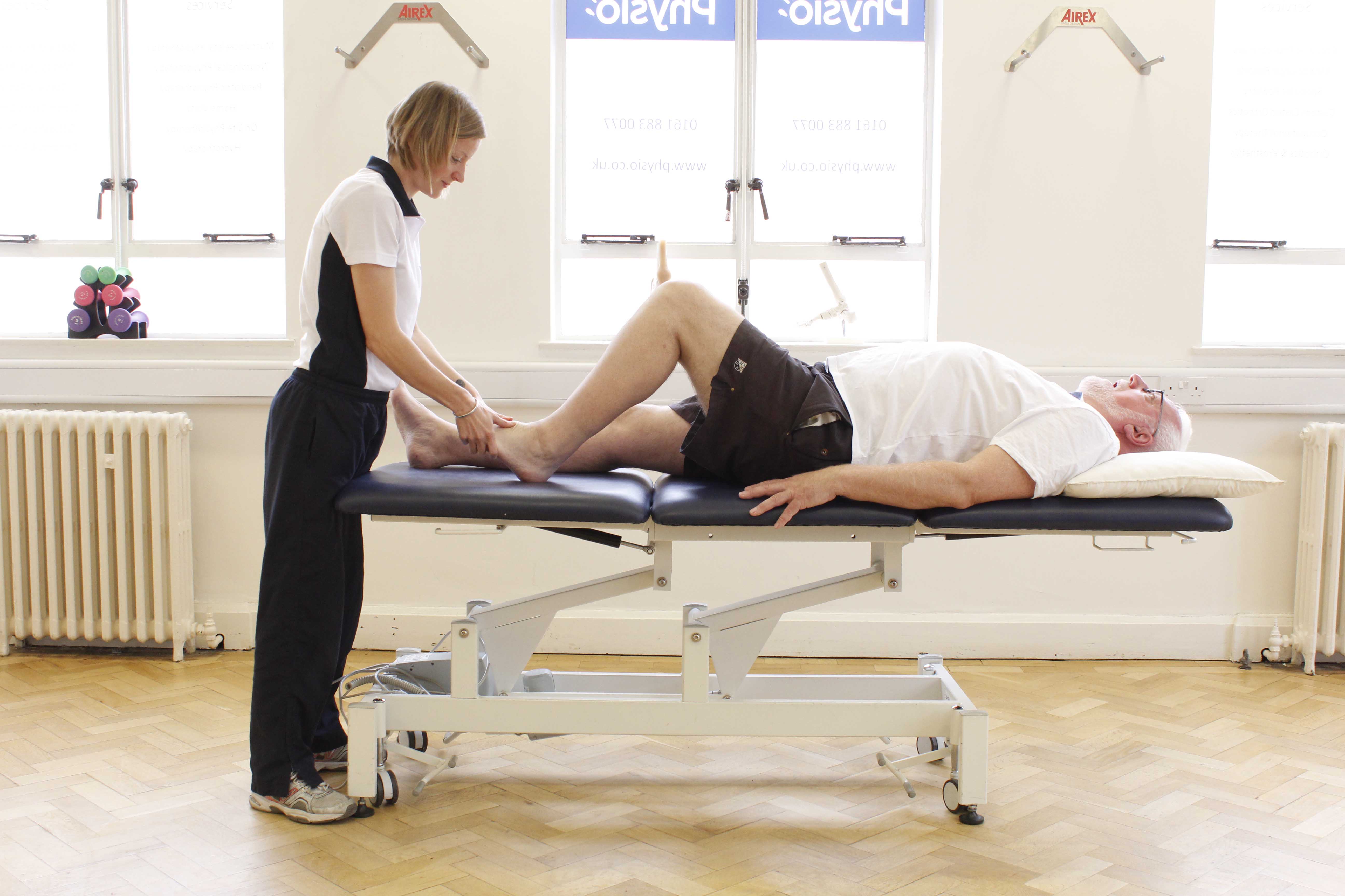 Massage and mobilisation of the ankle by a physiotherapist