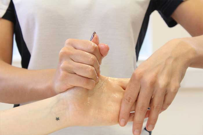 Customer receiving a hand massage 