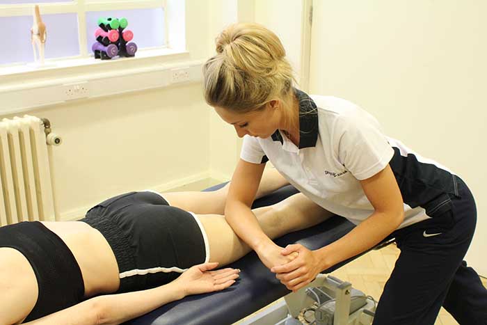 Customer Receiving Leg Massage in Manchester Physio Clinic
