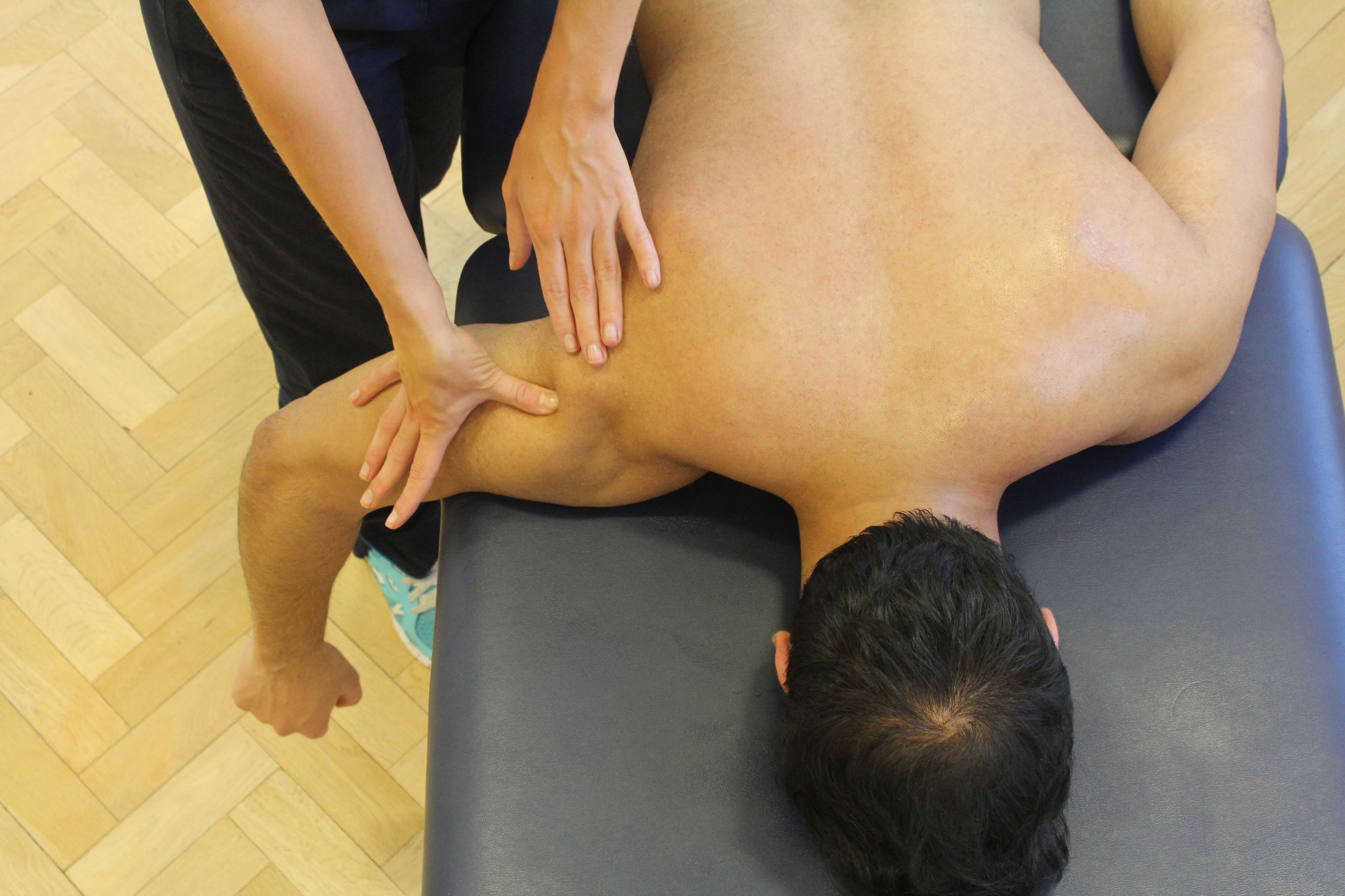 Mobilisation of the shoulder joint by experienced physiotherapist