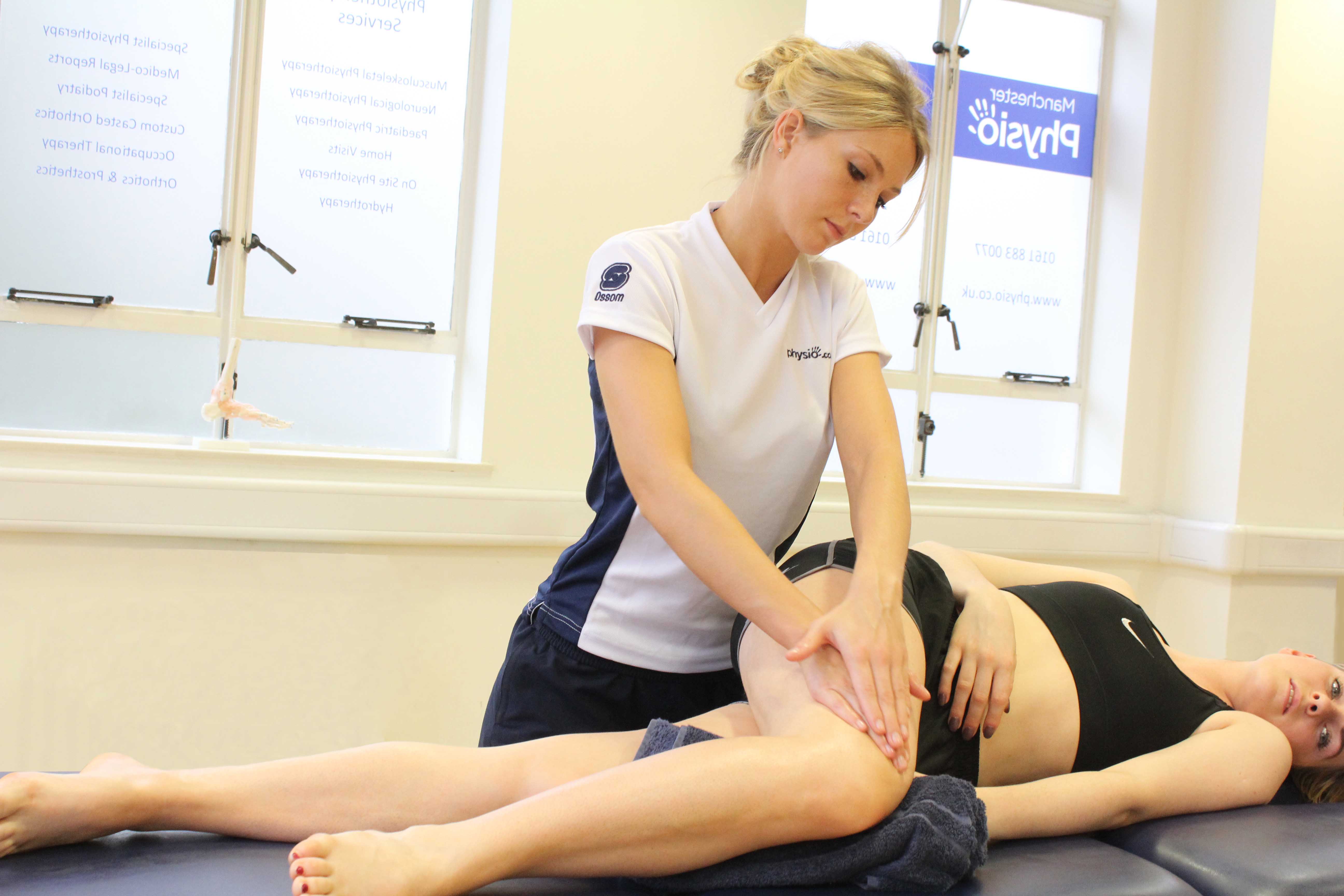 Soft tissue massage of the connective tissue around the patella and knee joint