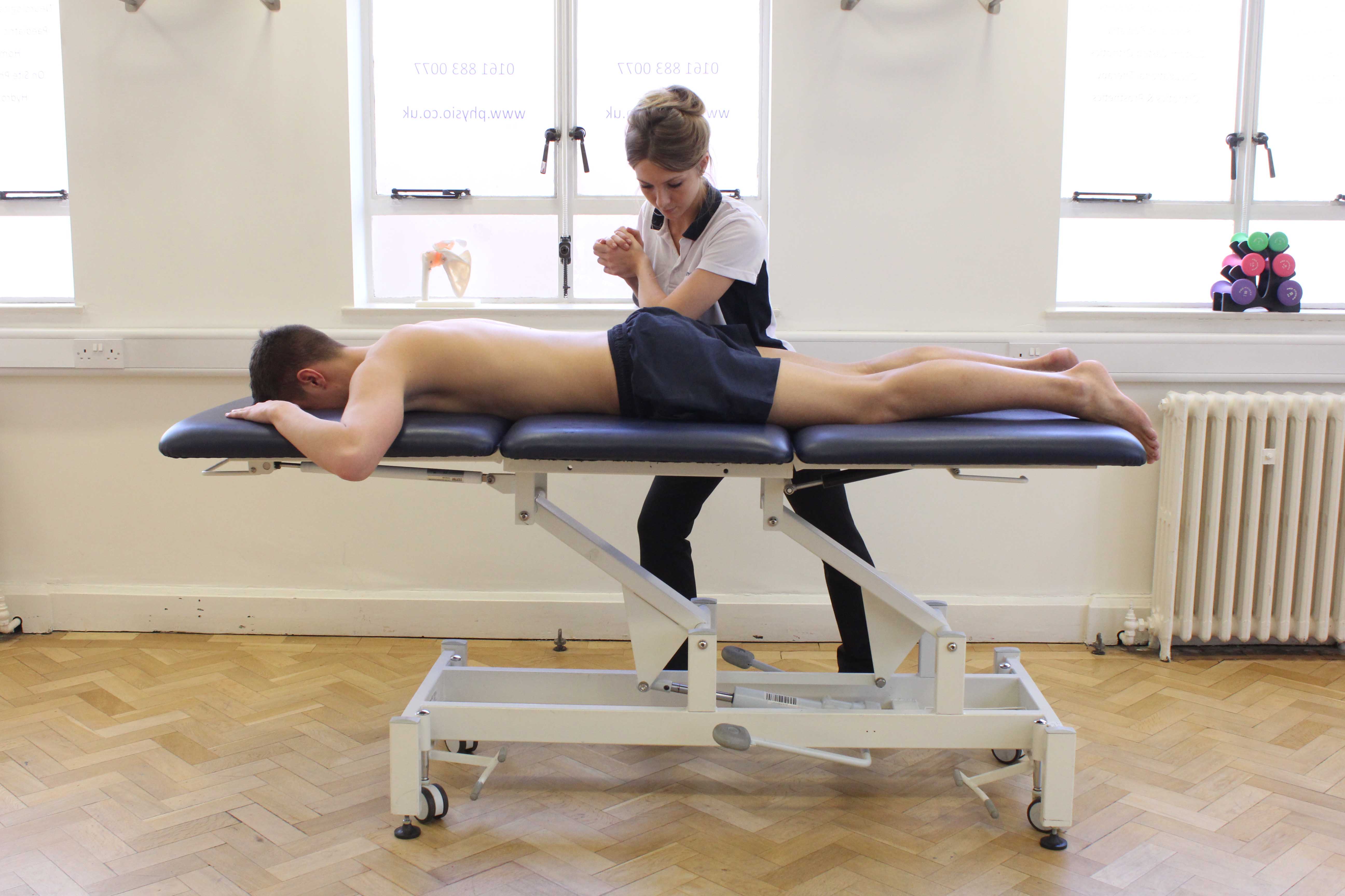 Trigger point massage of the leg adducter muscles by experienced MSK therapist