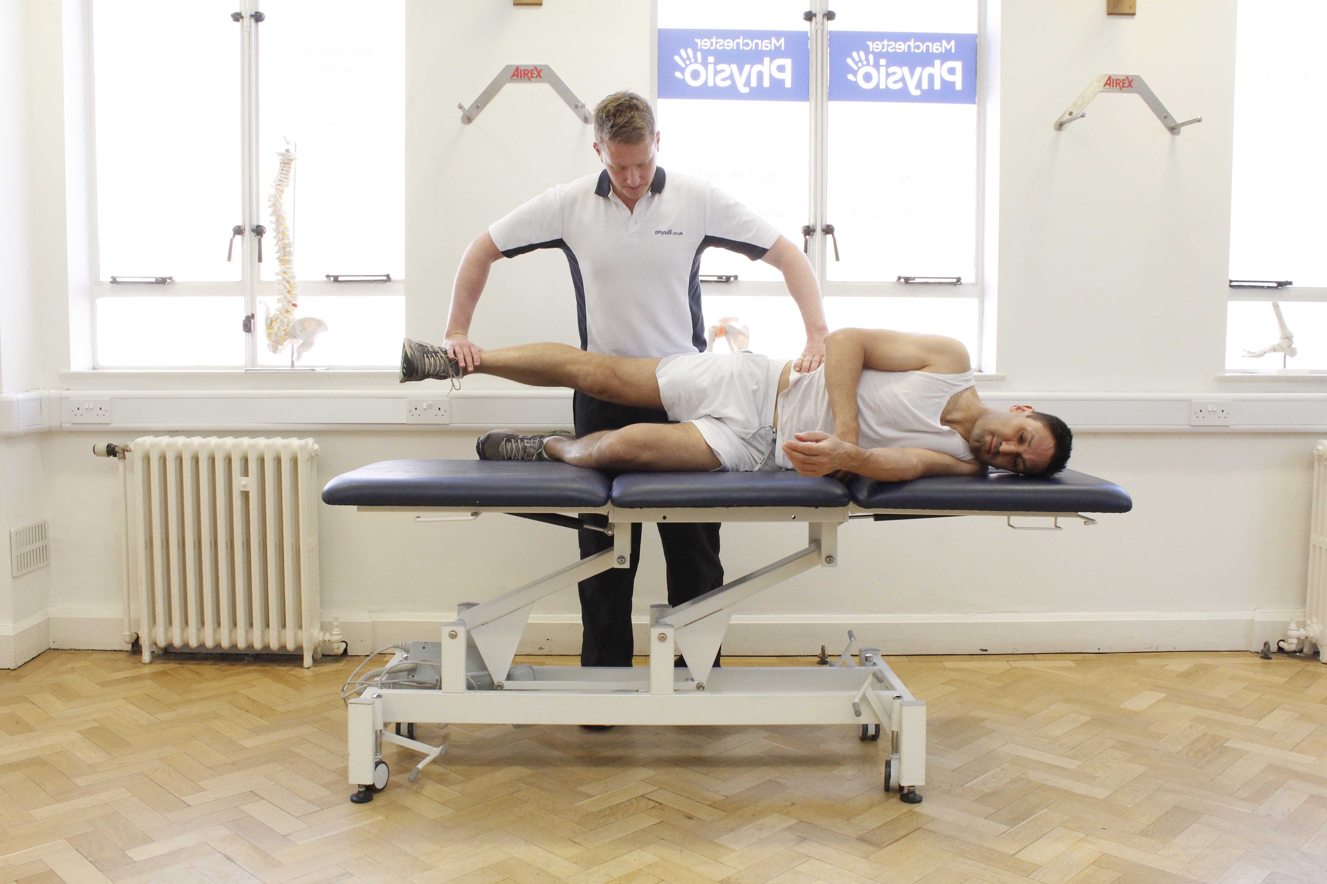 Hip abductor strengthening exercises assisted by a MSK physiotherapist