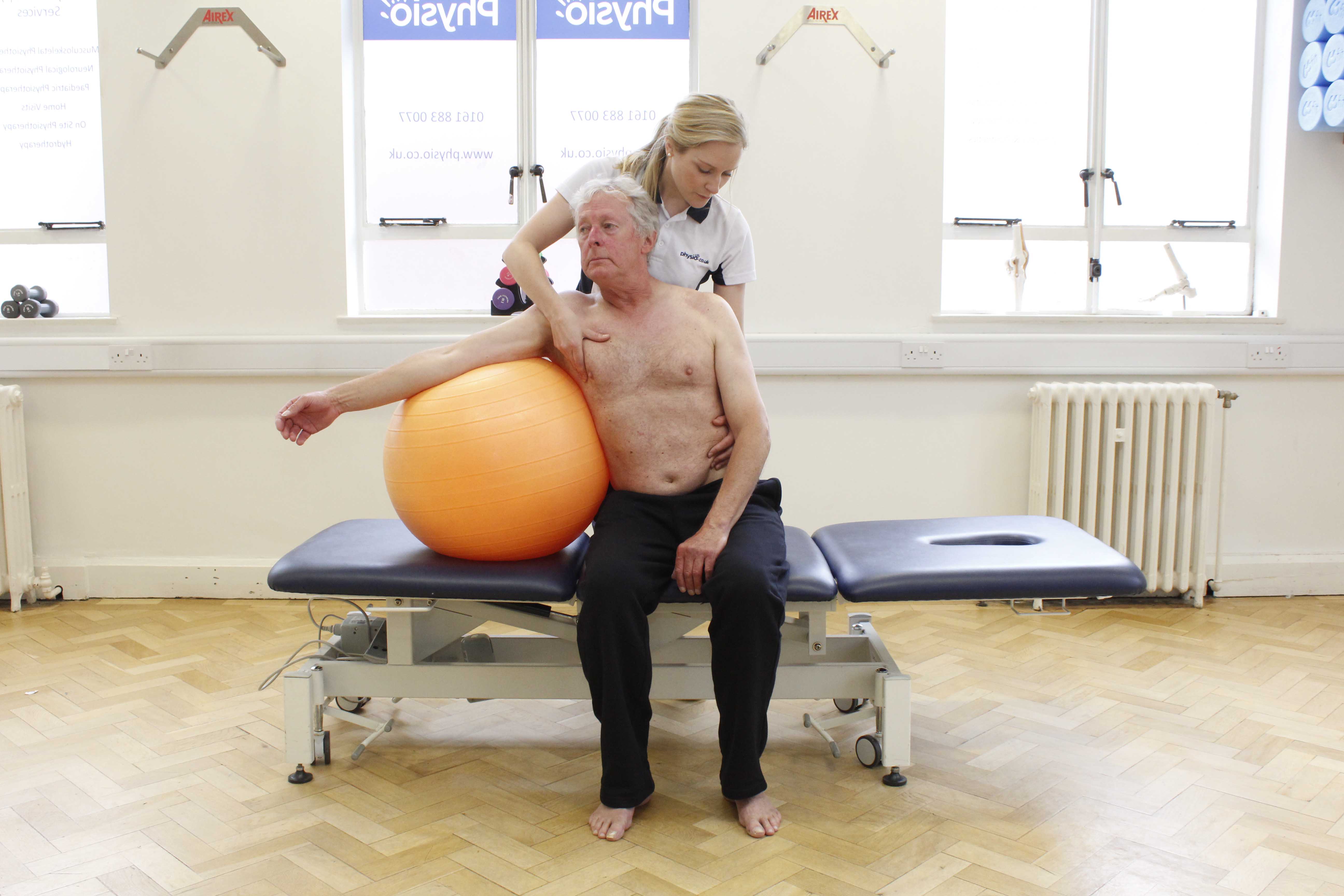 Mobilisation and stretch exercises for the spine assisted by an experienced physiotherapist