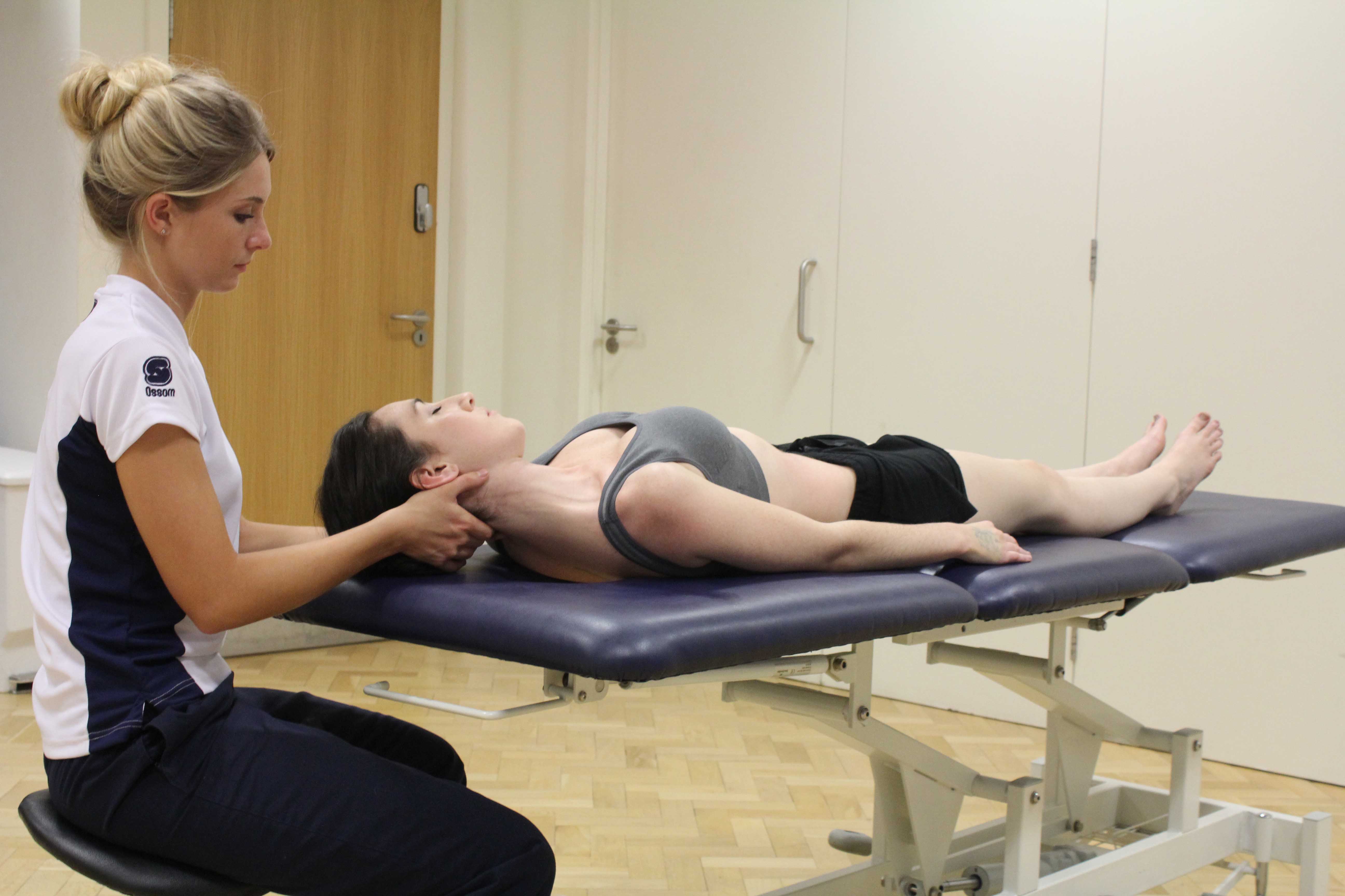 Neck realignment through gentle mobilisations and stretches performed by a paediatric physiotherapist