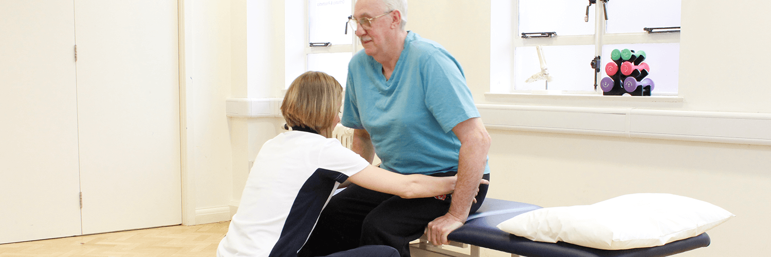 Elderly male recieves Neurological Physiotherapy aid via a trained physio.co.uk physiotherapist.