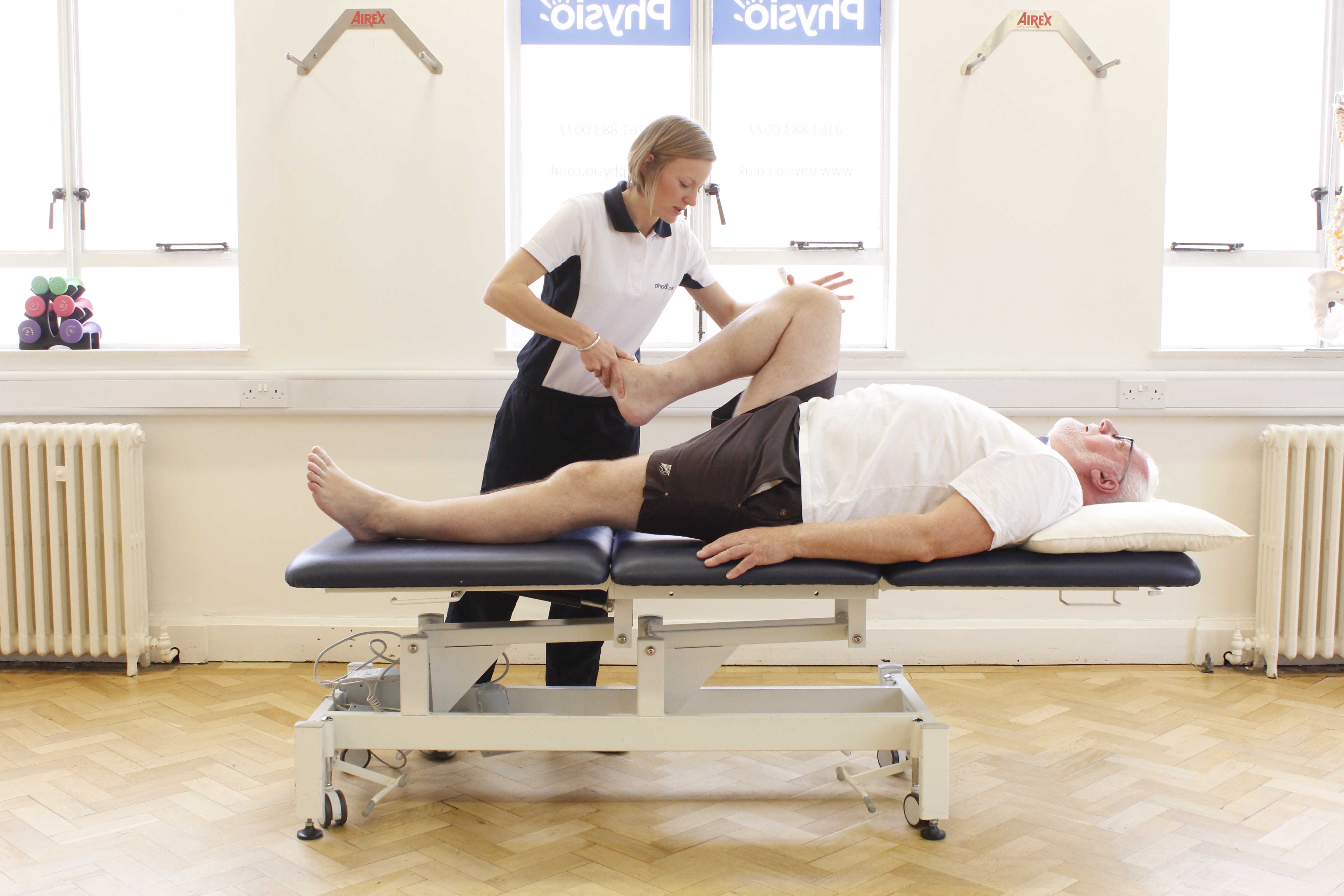 mobilisation and stretch exercises to the hip, knee and ankle applied by a specialist physiotherapist