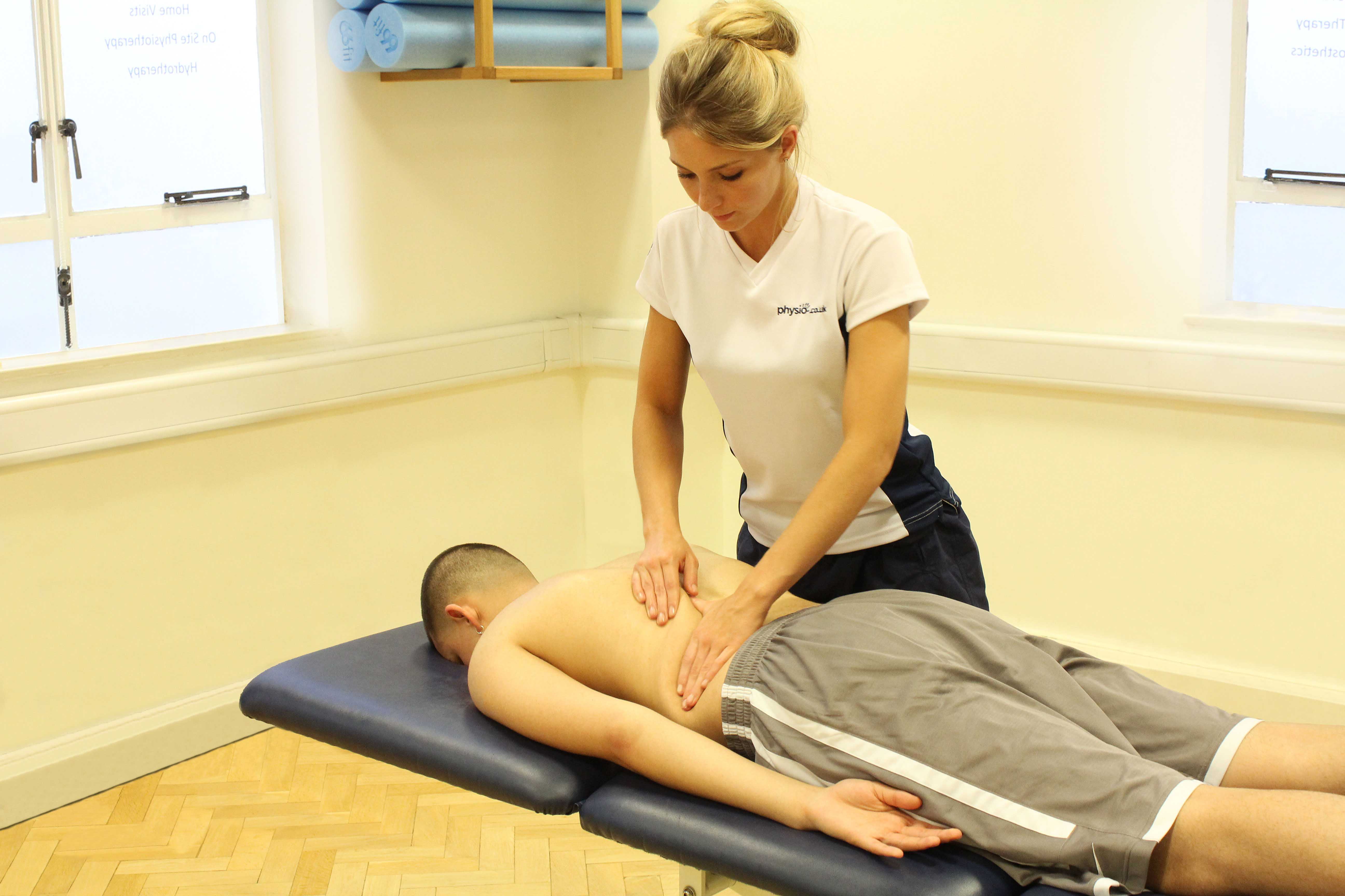 Soft tissue massage of the upper arms and shoulders following exercise to reduce muscle soreness