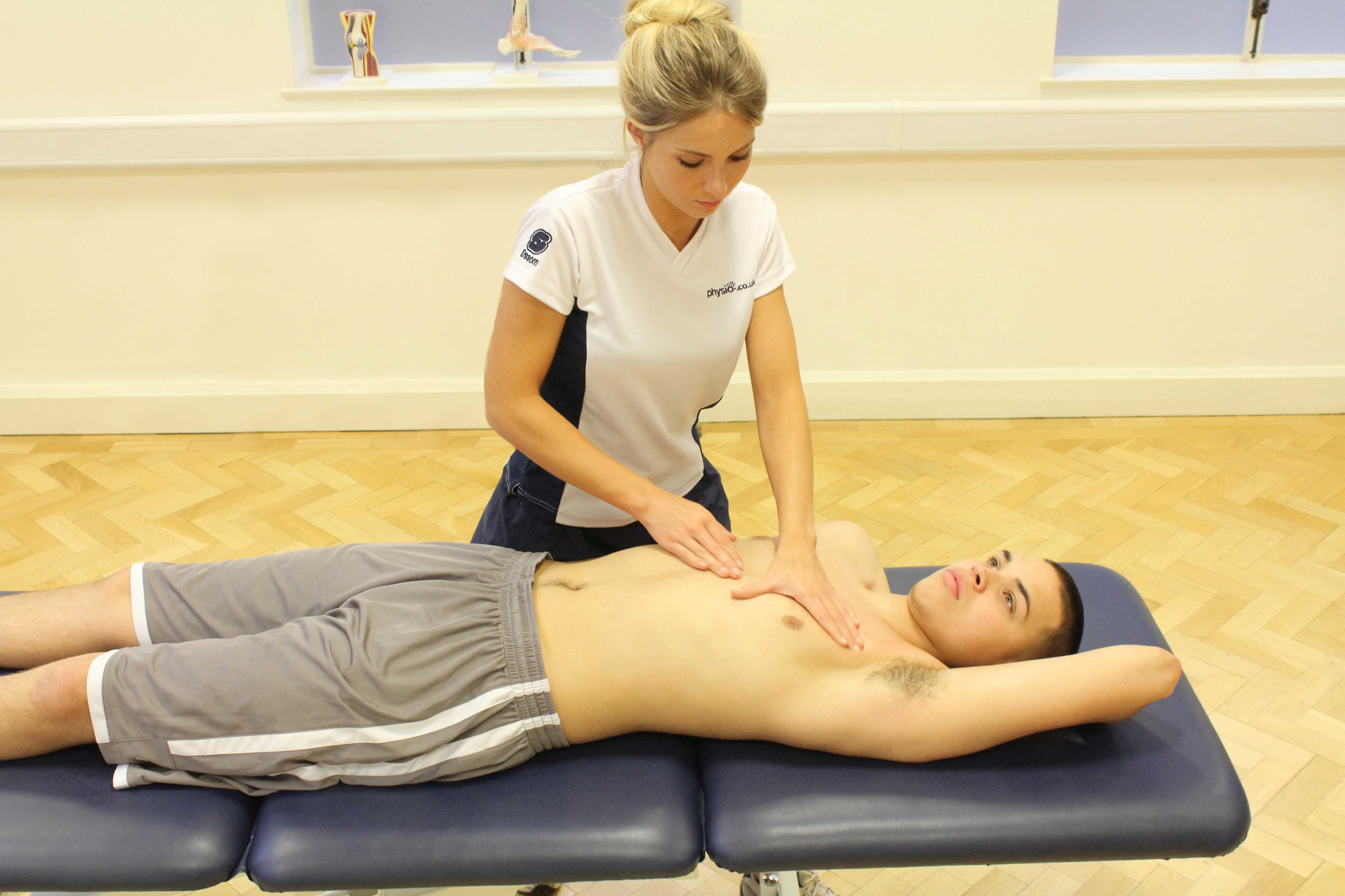 Soft tissue massage of the chest muscles by specialist therapist