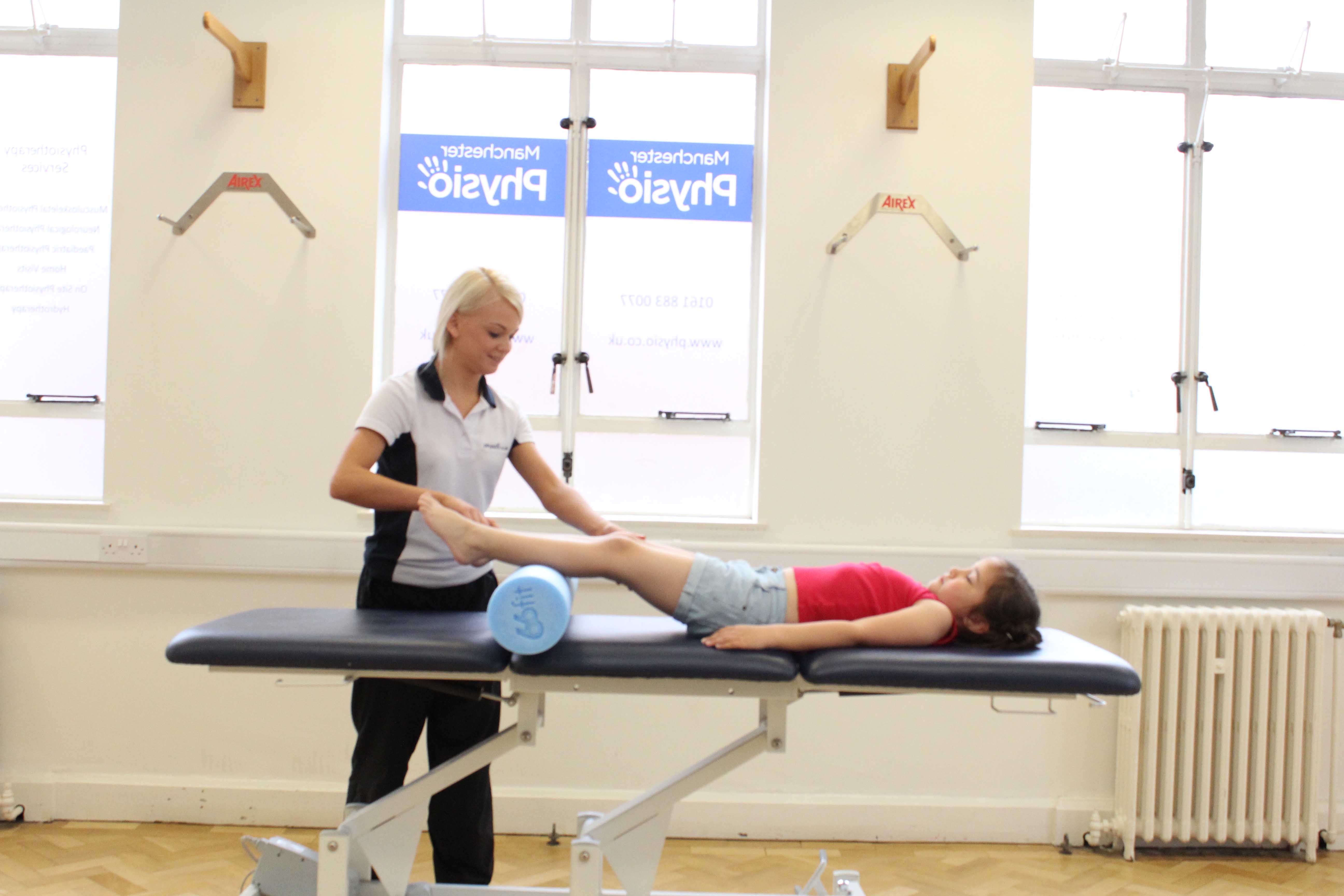 Mobilisations and stretches of the hip, knee and ankle by a paediatric physiotherapist