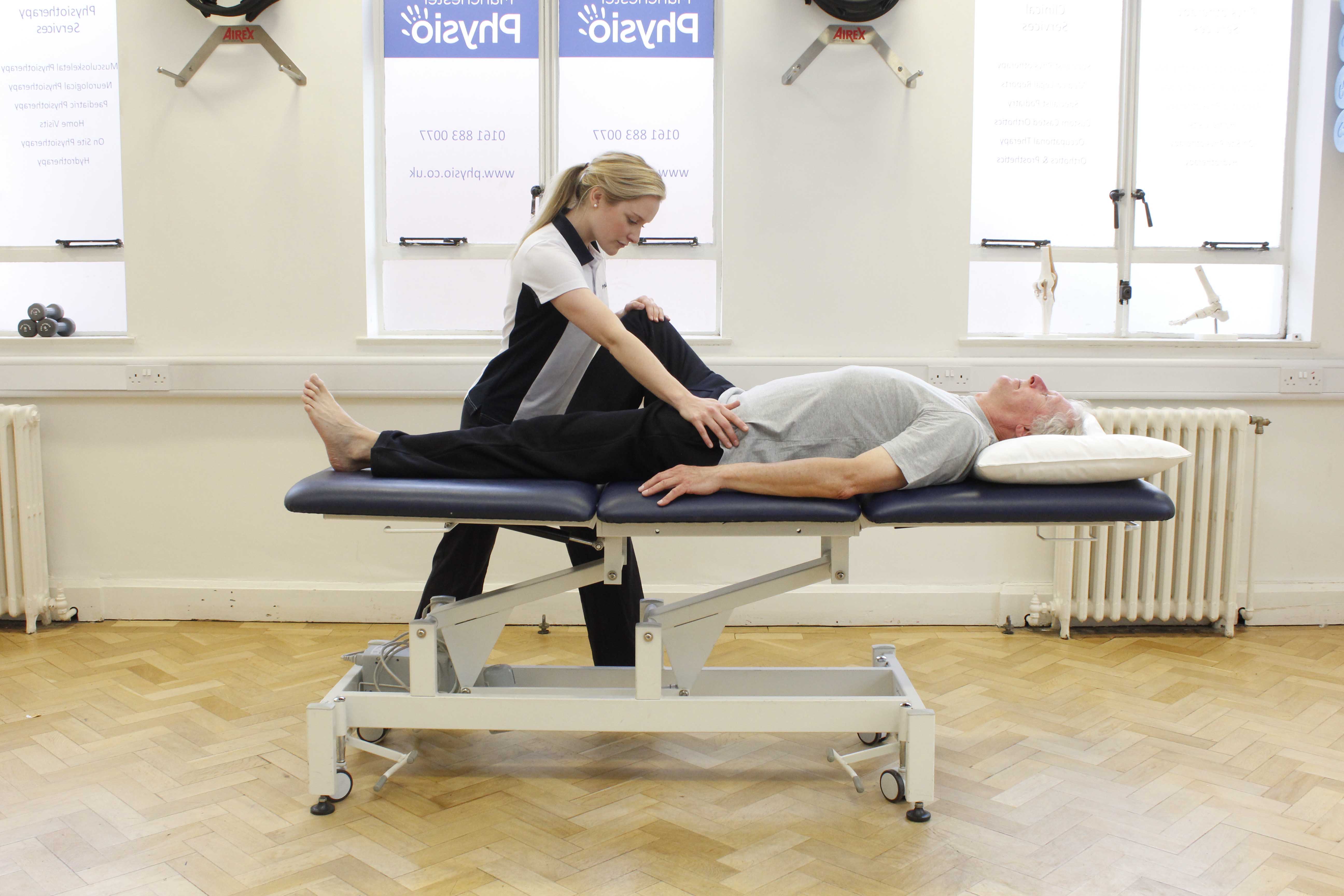 Pelvis and hip abduction stretches assisted by specialist physiotherapist