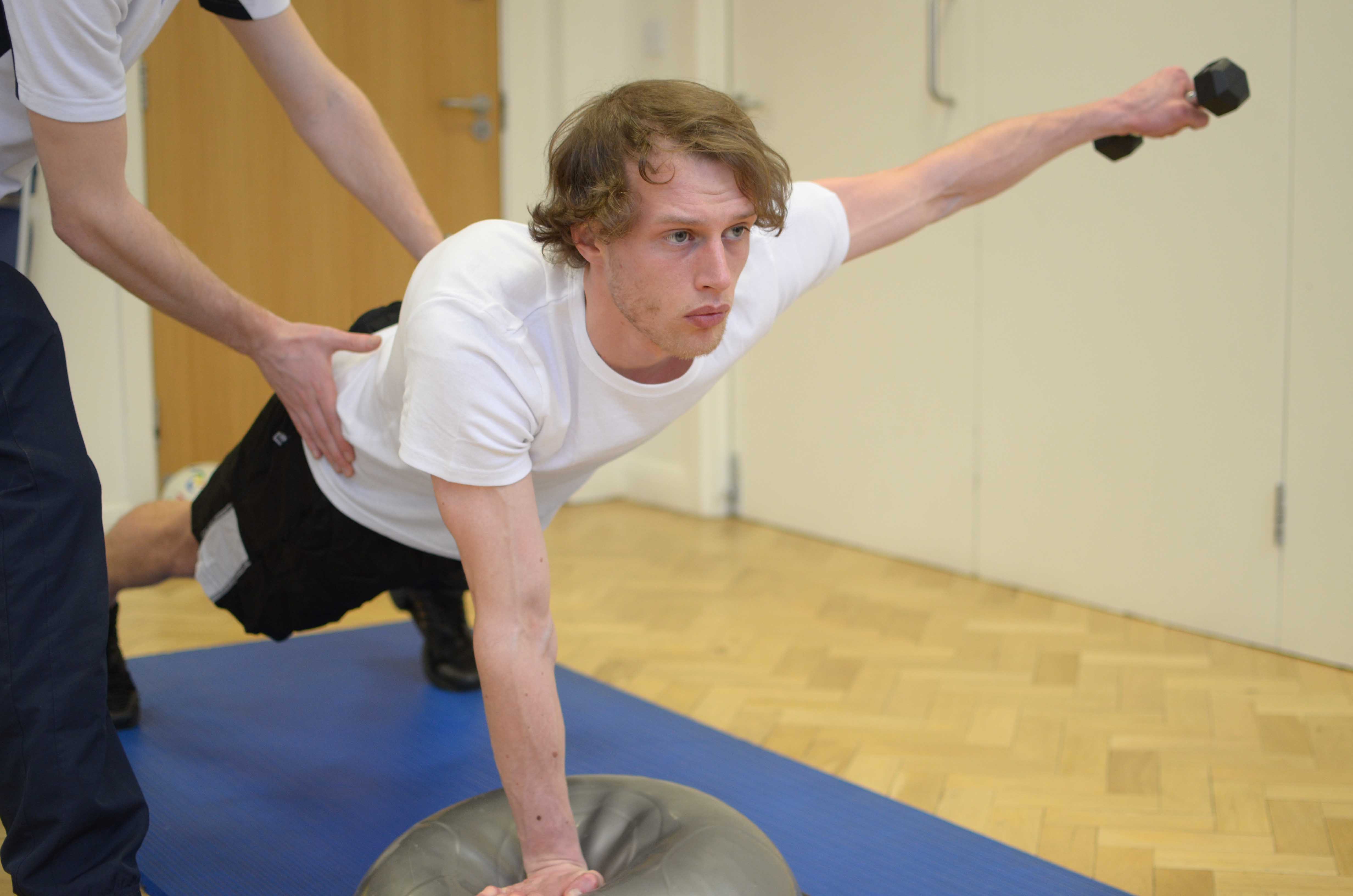 Dynamic balance and co-ordination exercises assisted by an experienced Physiotherapist