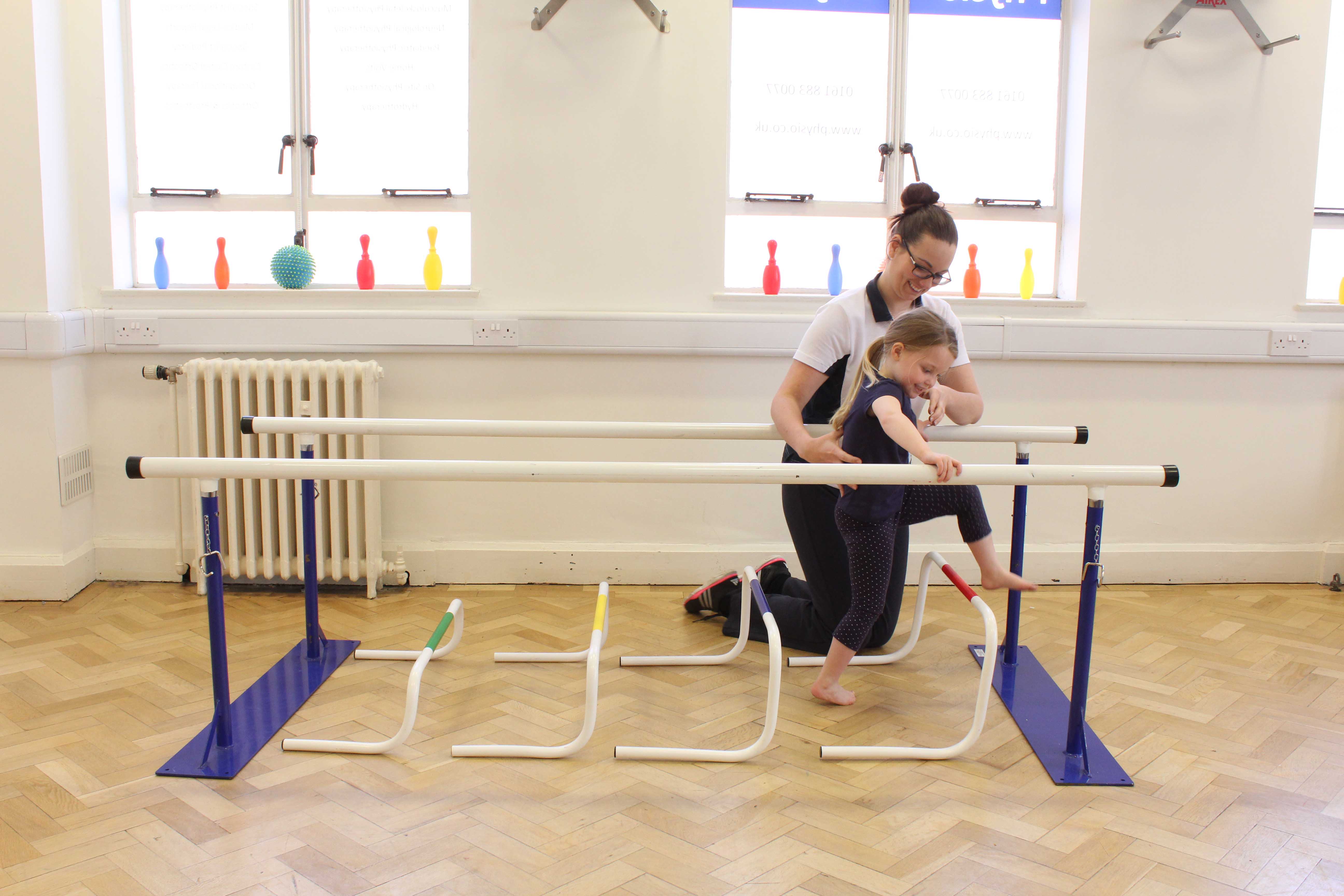 Gait re-education and mobility exercises between parallel bars, under supervision from a neurological physiotherapist