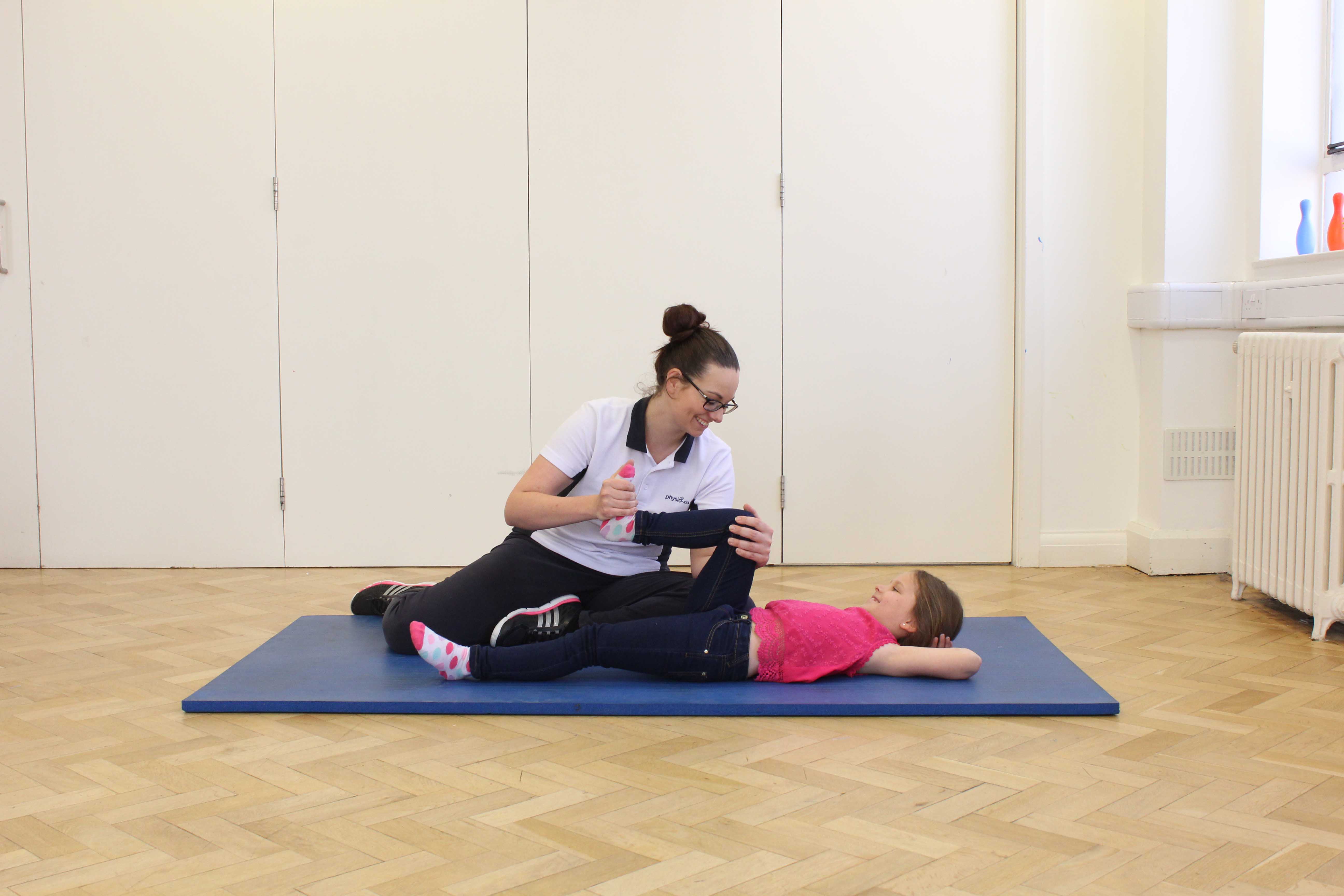 Upper limb mobility and co-ordination exercises assisted by a paediatric physiotherapist