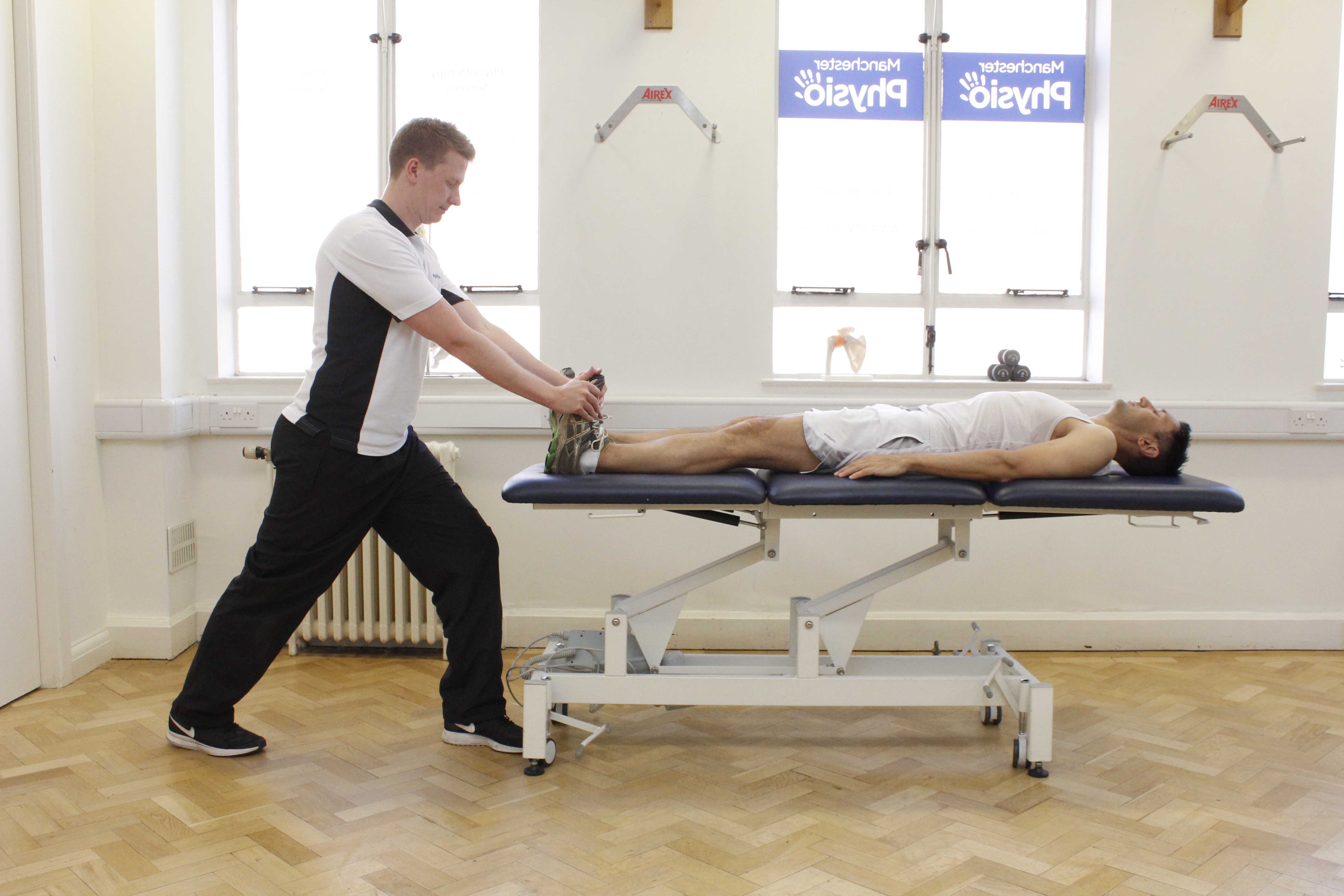 Passive stretch of the achilles tendon performed by specialist therapist
