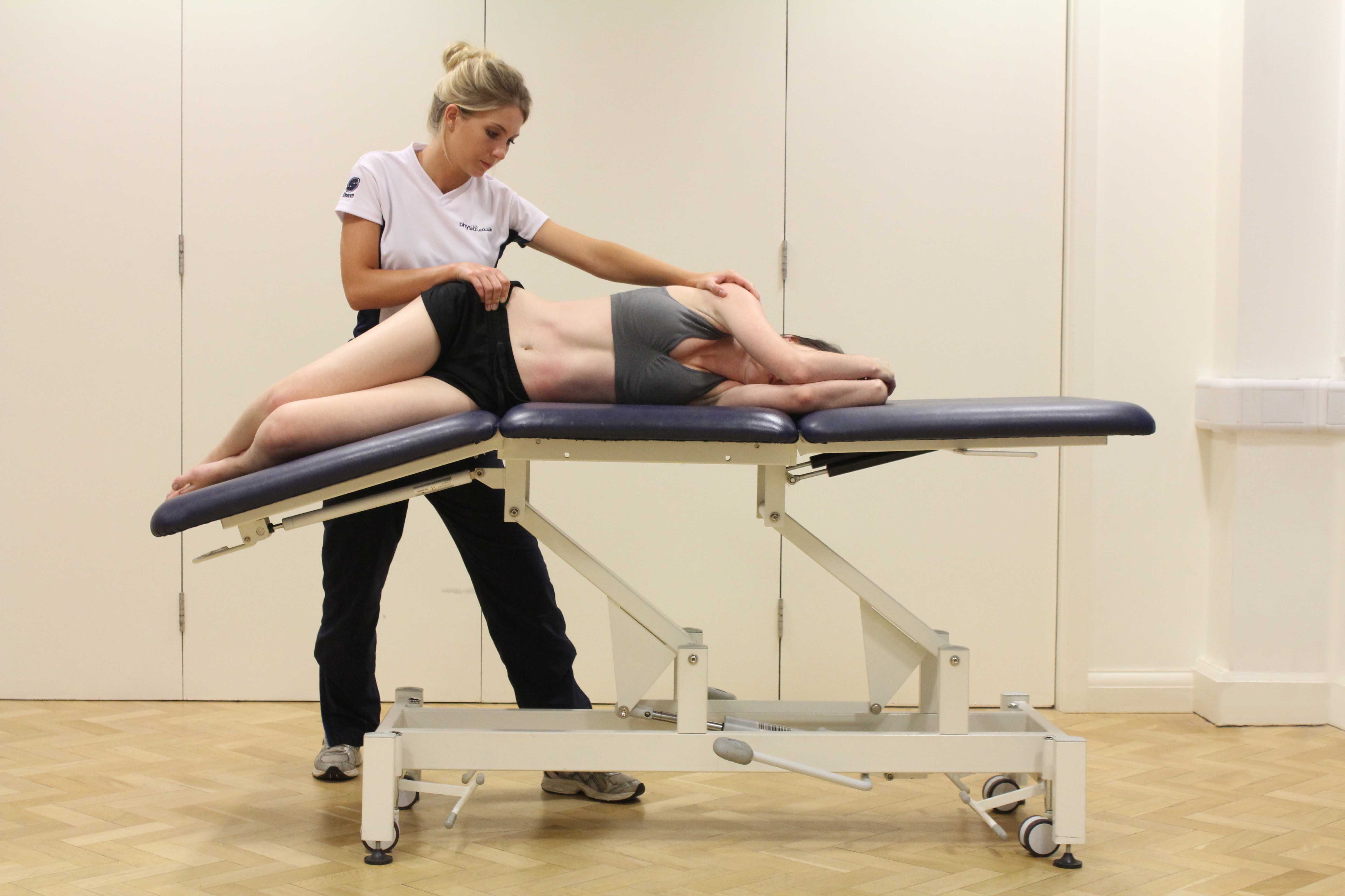 Passive stretch of the hip and pelvic muscles by specialist MSK therapist