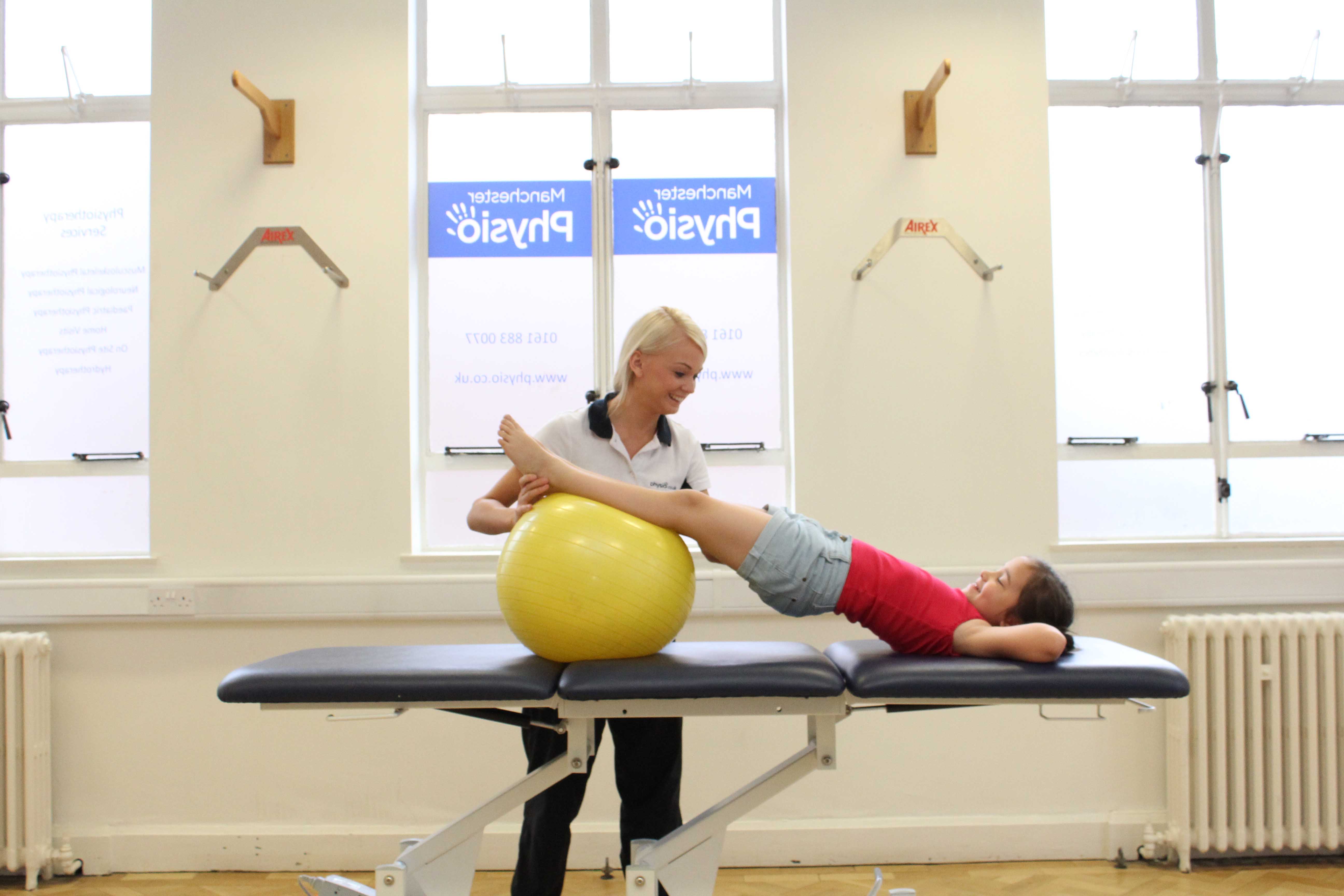 Core strength bridging exercise under close supervision of physiotherapist