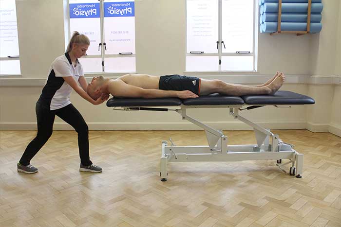 Customer reciving head massage in Manchester Physio Clinic