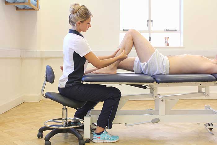 Customer reciving lower leg massage while in a relaxed position