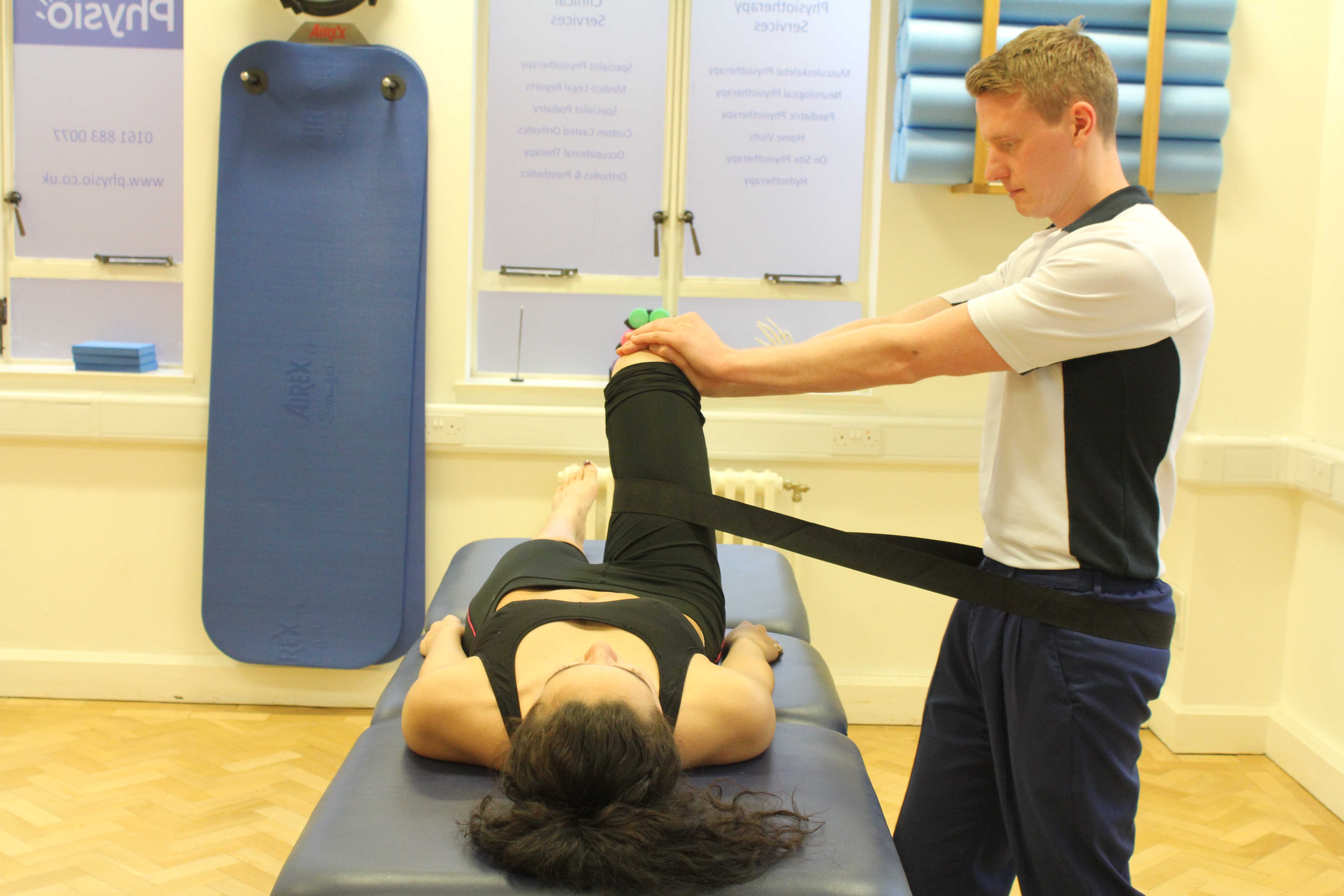 Mobilisations of the hip joint with a strap by an experienced physiotherapist