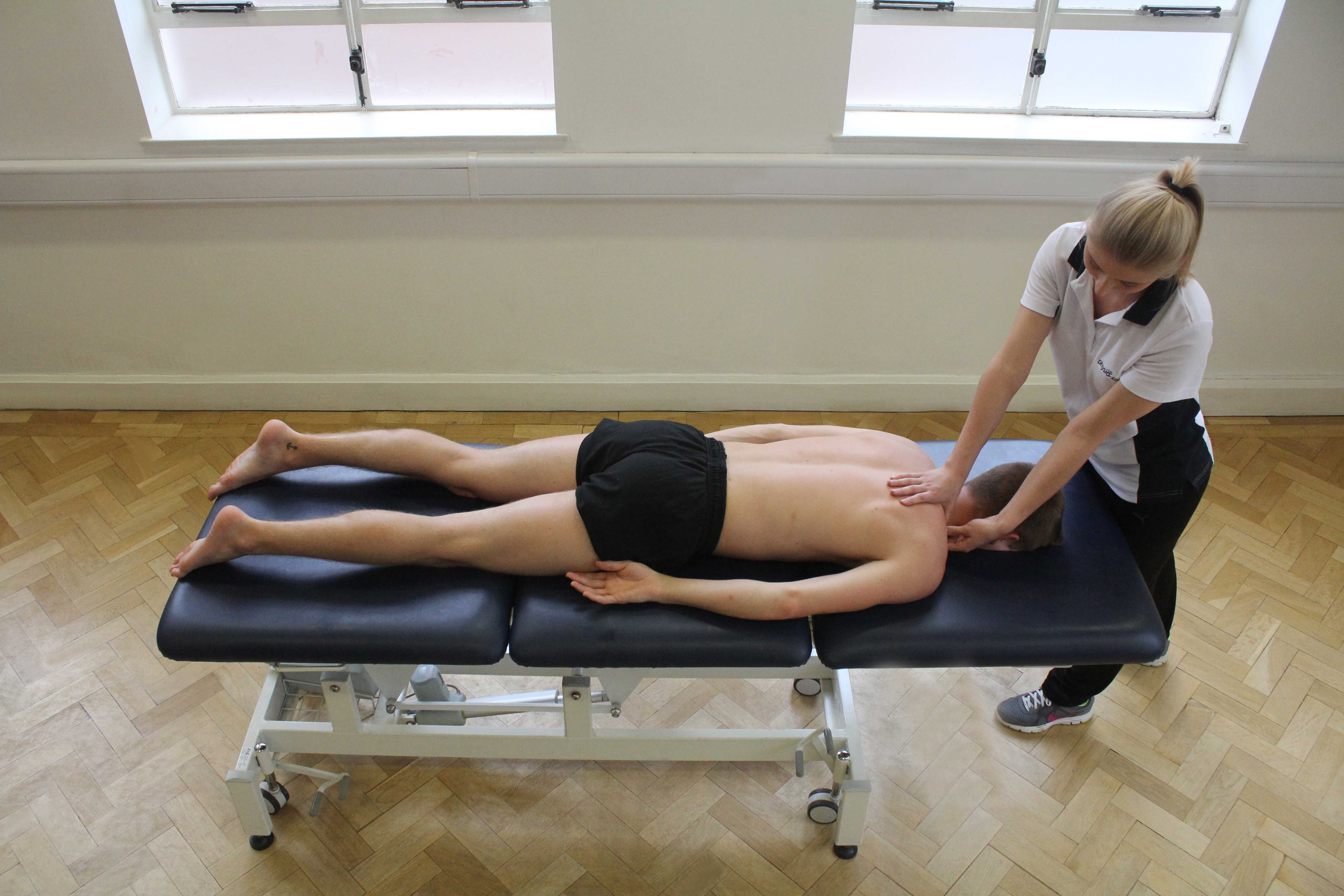 Trigger point massage applied to trapezius muscle