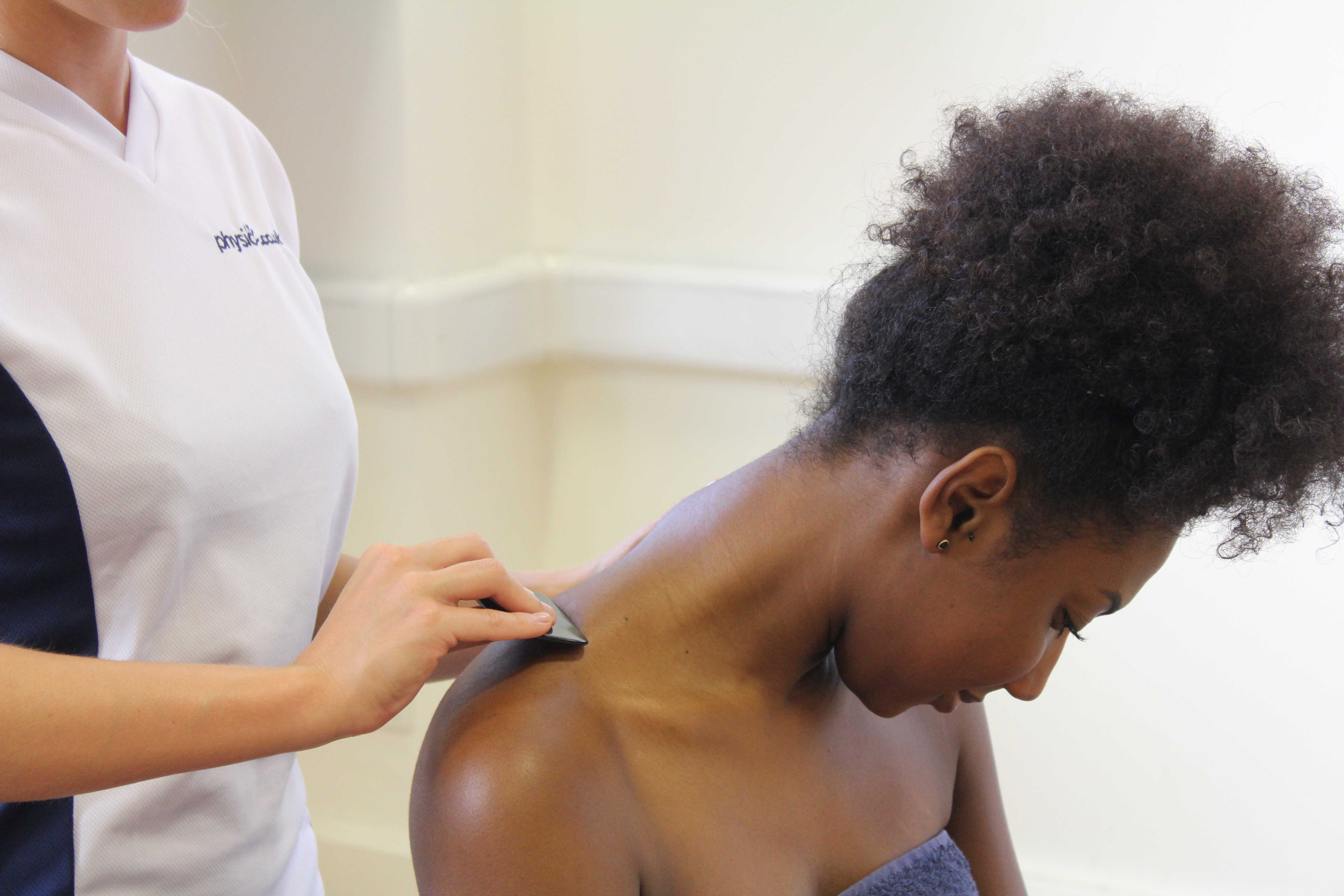 Soft tissue massage of the muscle and connective tissues in the neck by specialist MSK therapist