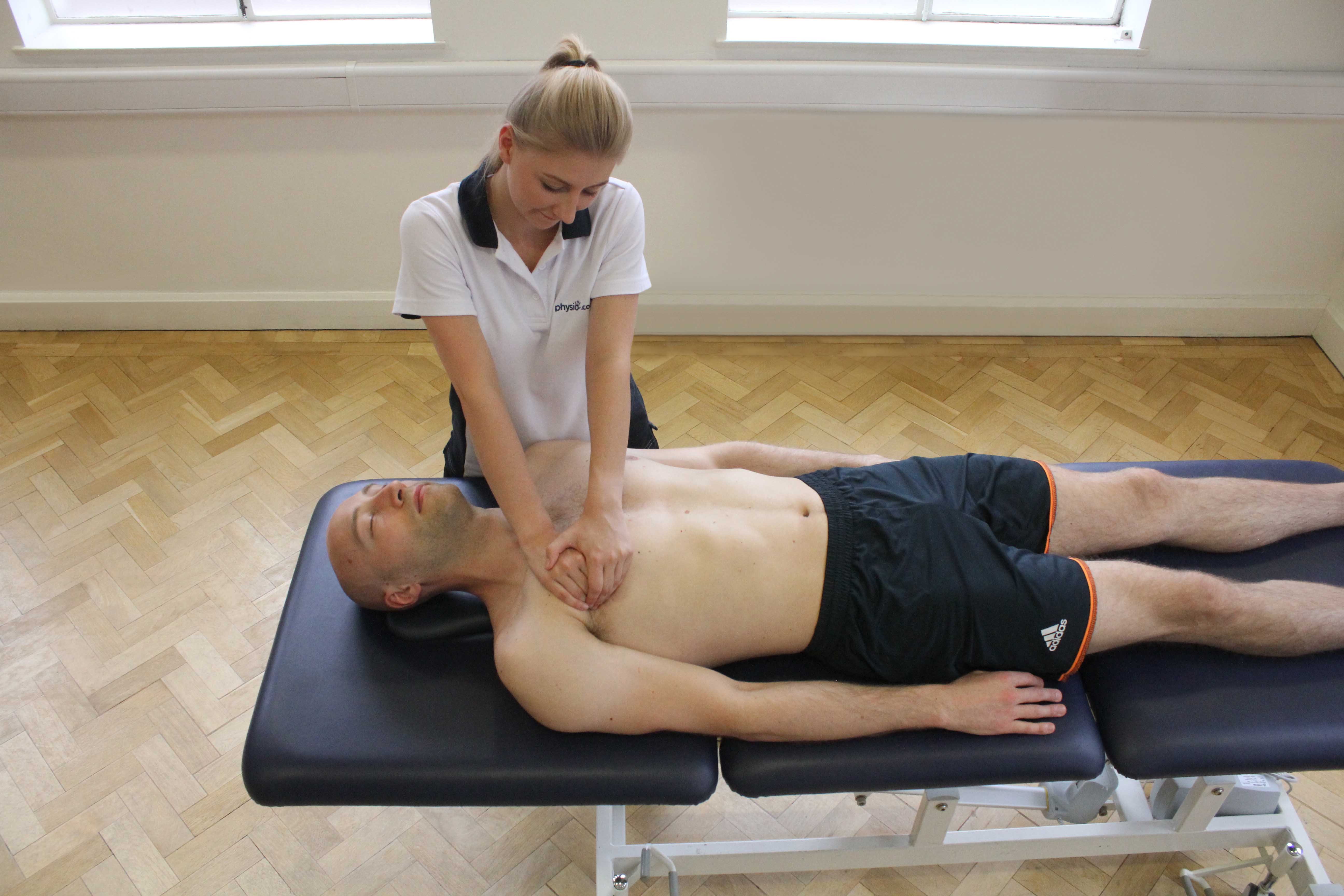 Soft tissue massage of the chest muscle and connective tissues