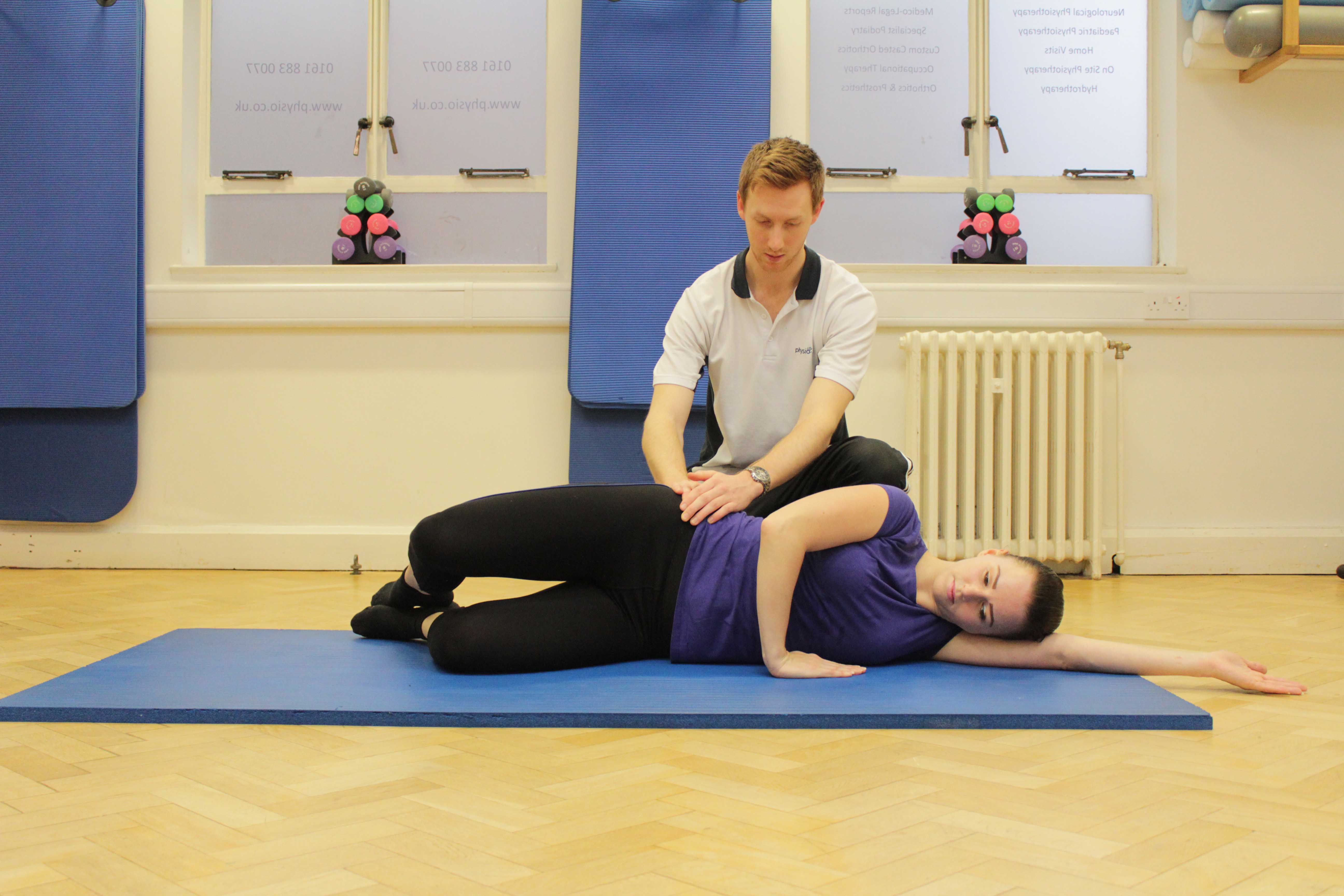Strengthening exercises for the gluteus muscles supervised by a therapist