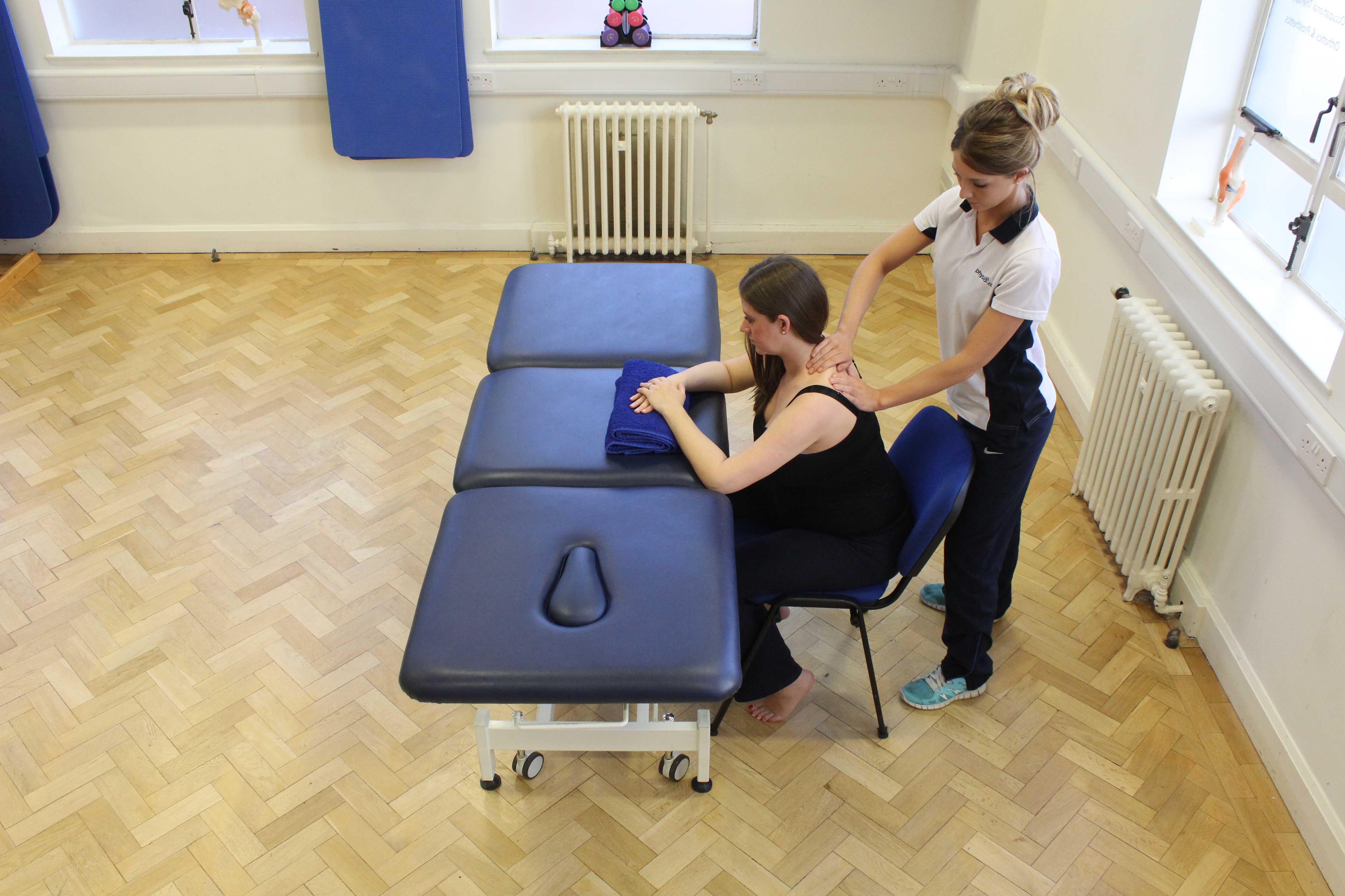 Soft tissue massage of the muscle and connective tissues in the neck by specialist MSK therapist