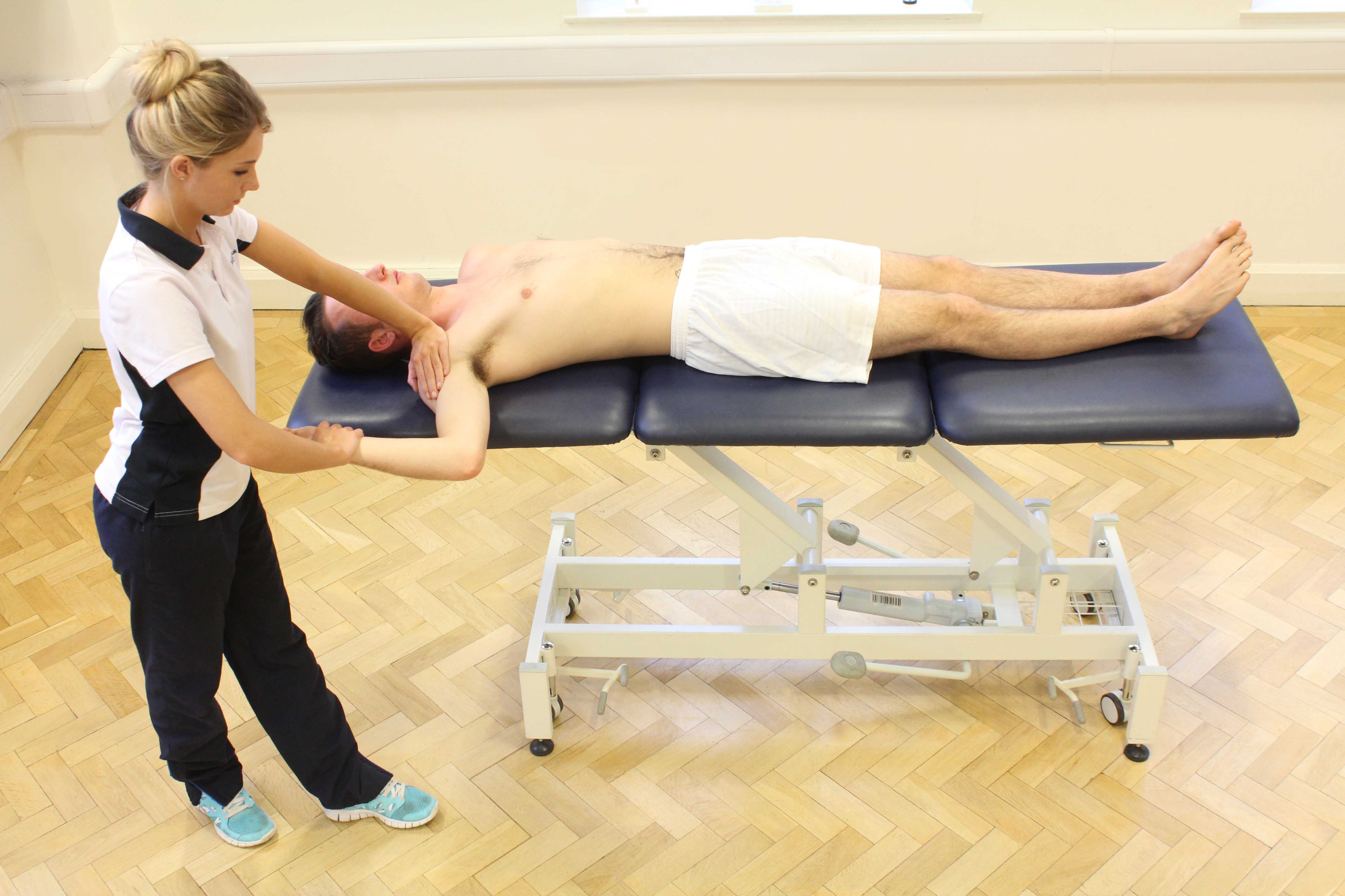Soft tissue massage of the palma fascia to relieve pain and stiffness