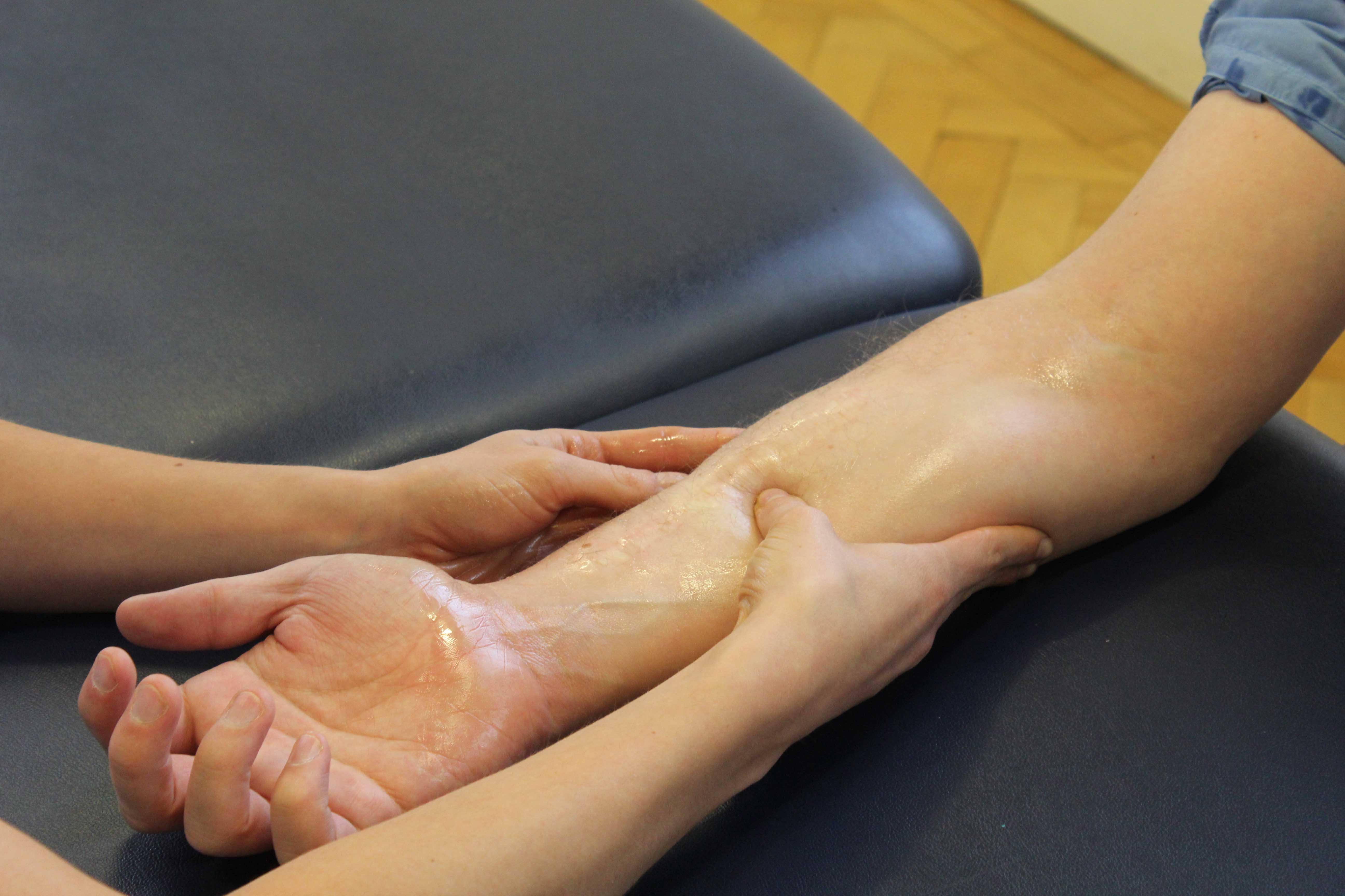 Soft tissue massage of the pectrol muscle by experienced therapist