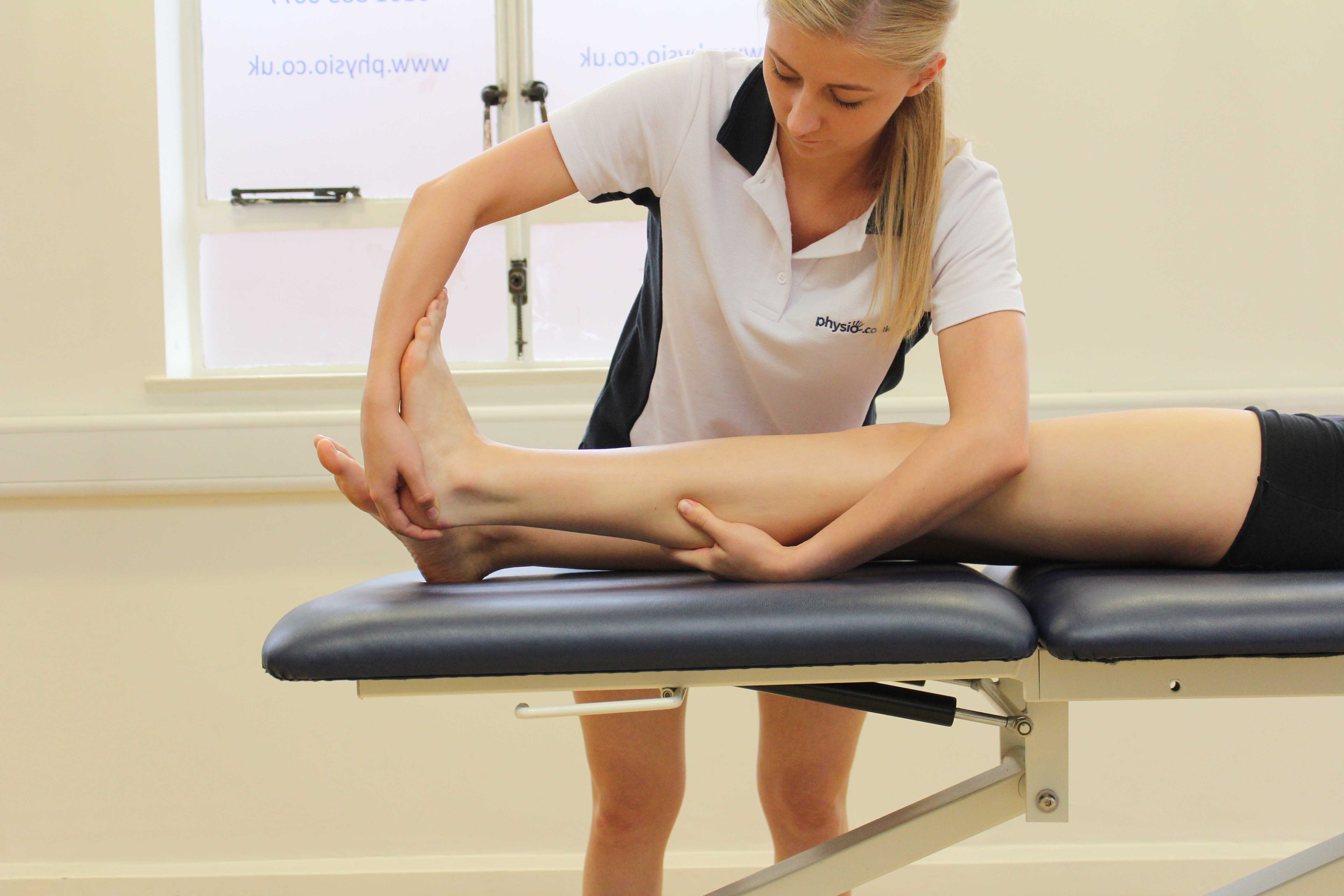 beating percussion massage applied to the hamstrings by specialist therapist