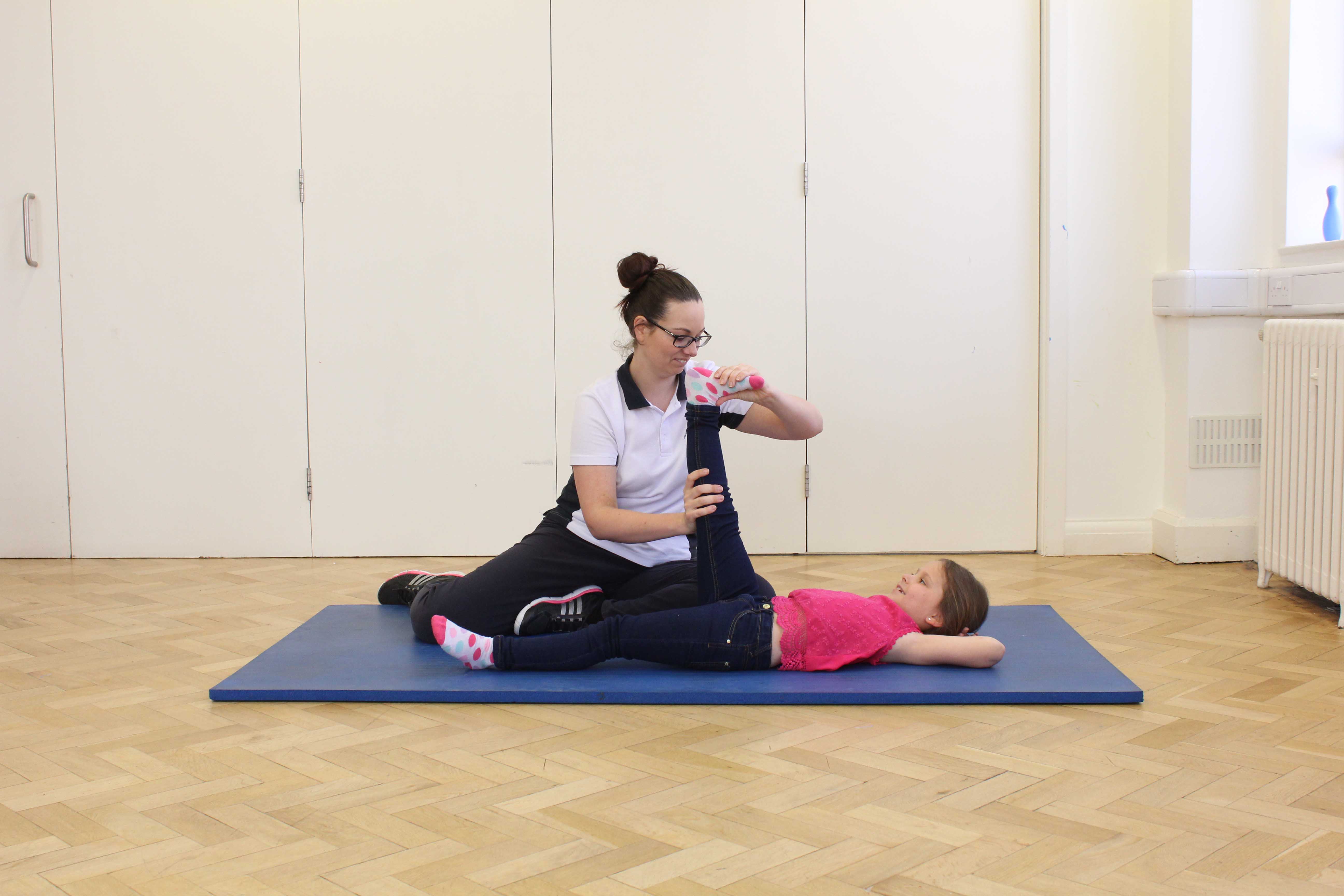 Passive stretches of the hip, knee and ankle to reduce contractures of the lower limb