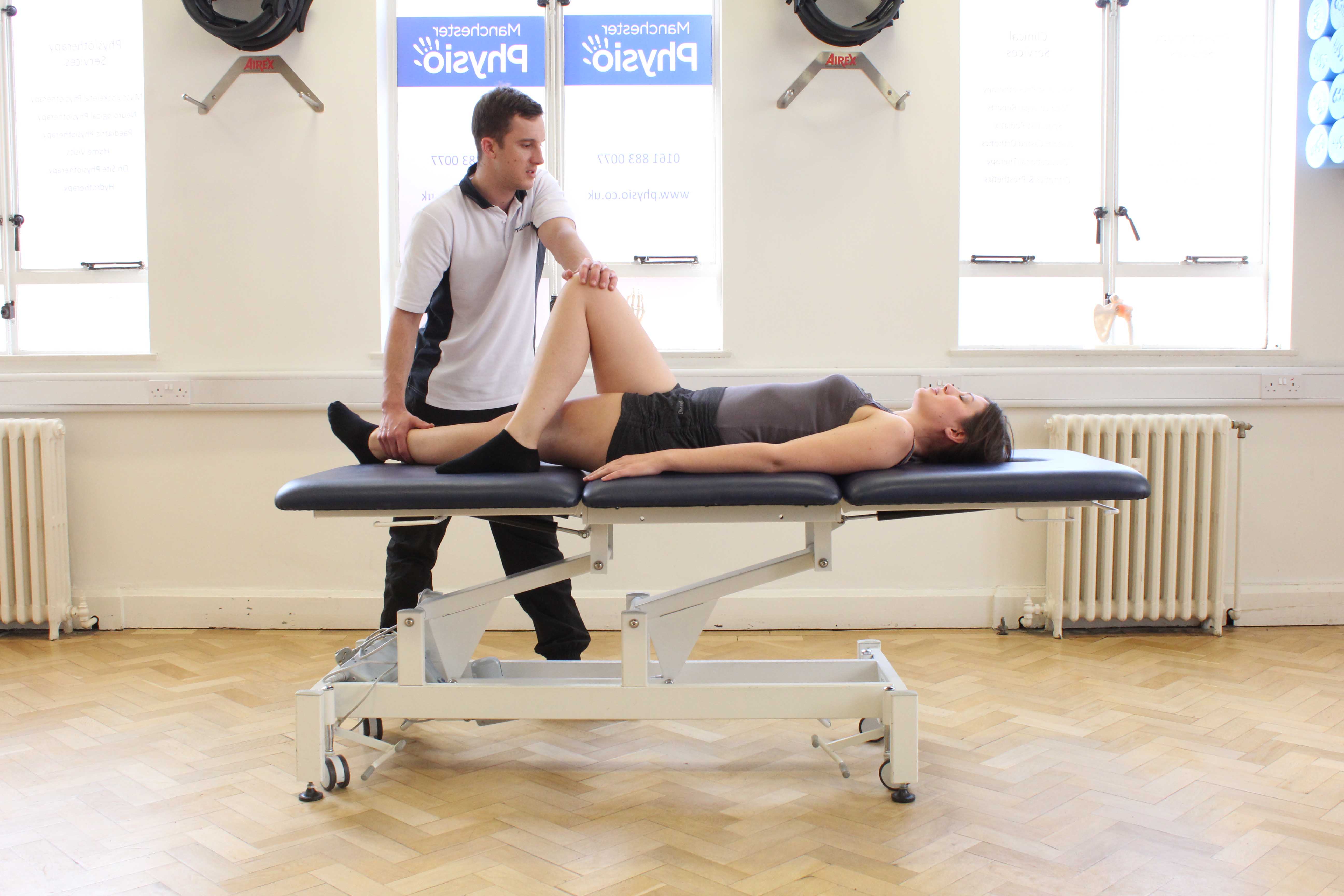 Passive stretch of the muscles and connective tissues of the hip and pelvis by specialist therapist