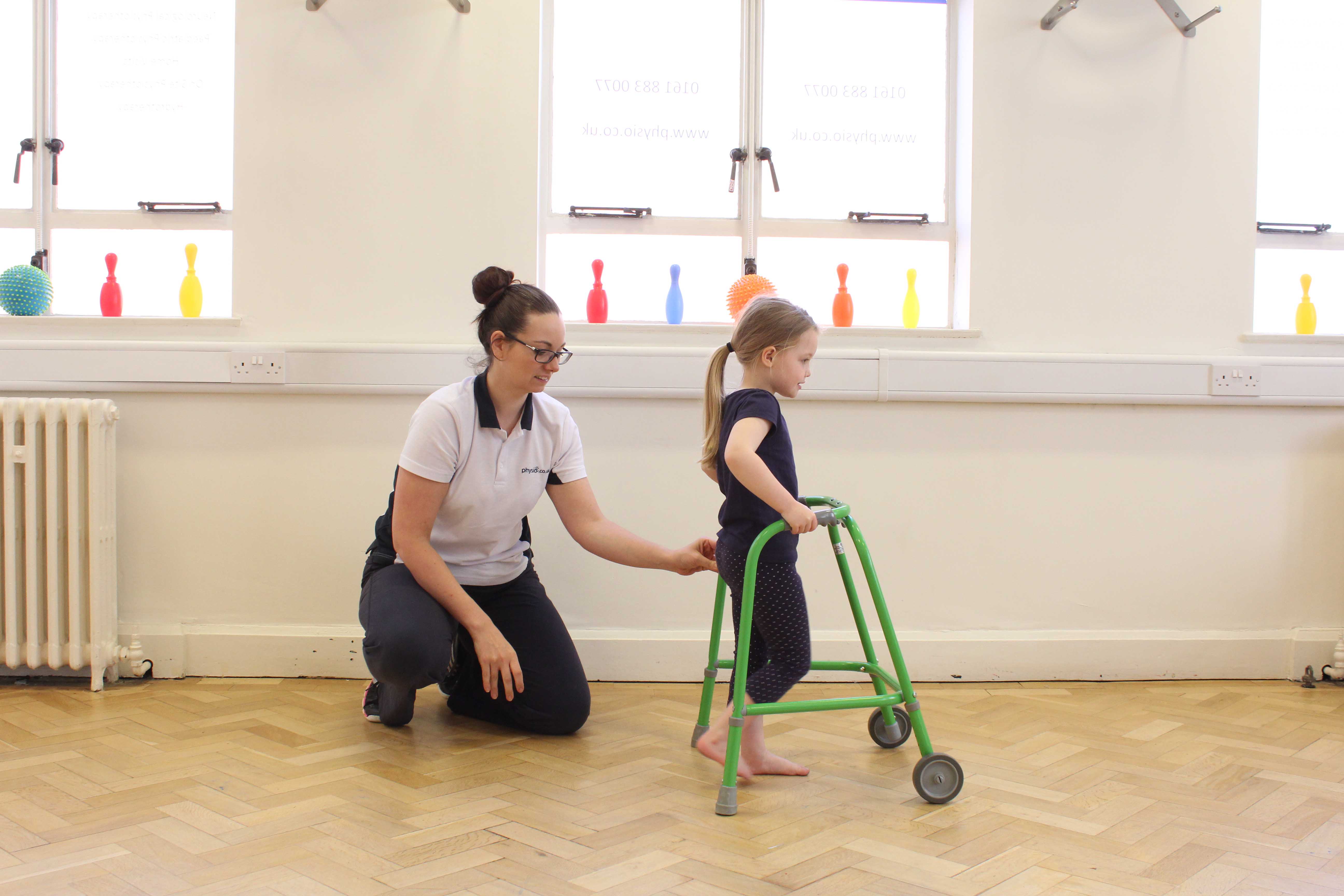 Mobility exercises supported by a trunk orthotic and wheeled walking frame